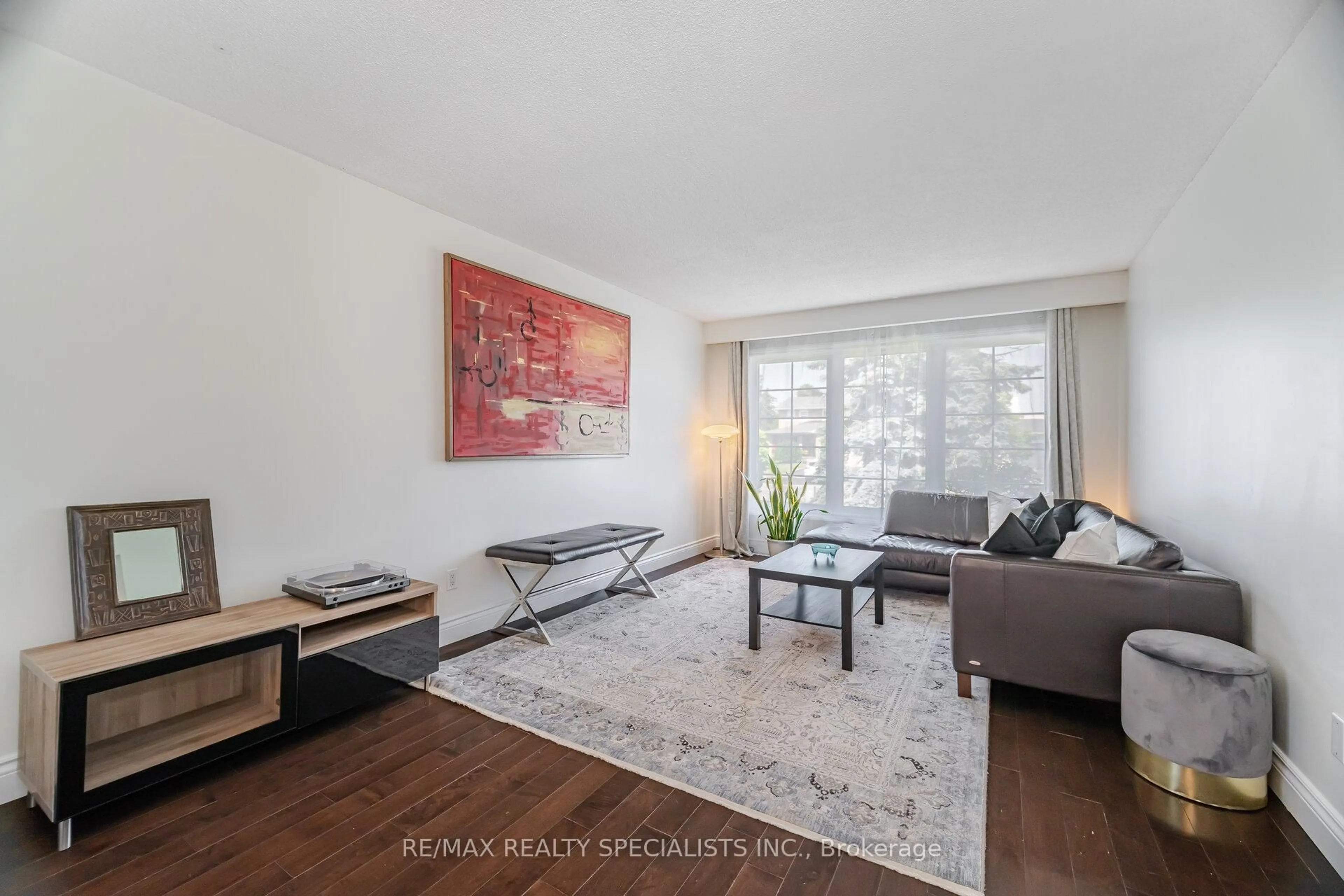 Living room with furniture, wood/laminate floor for 796 Childs Dr, Milton Ontario L9T 4J2