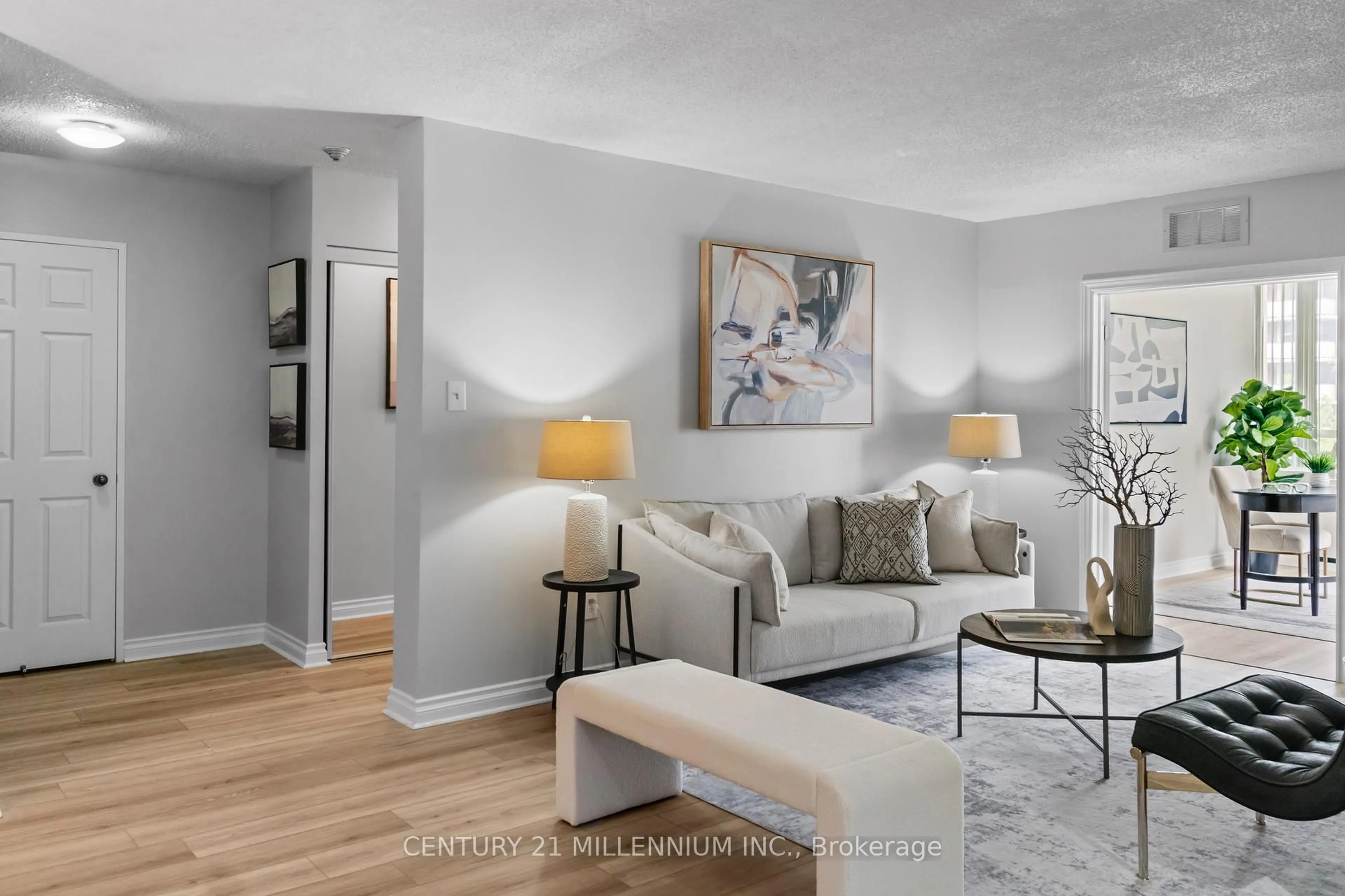 Living room with furniture, wood/laminate floor for 5 Lisa St #401, Brampton Ontario L6T 4T4