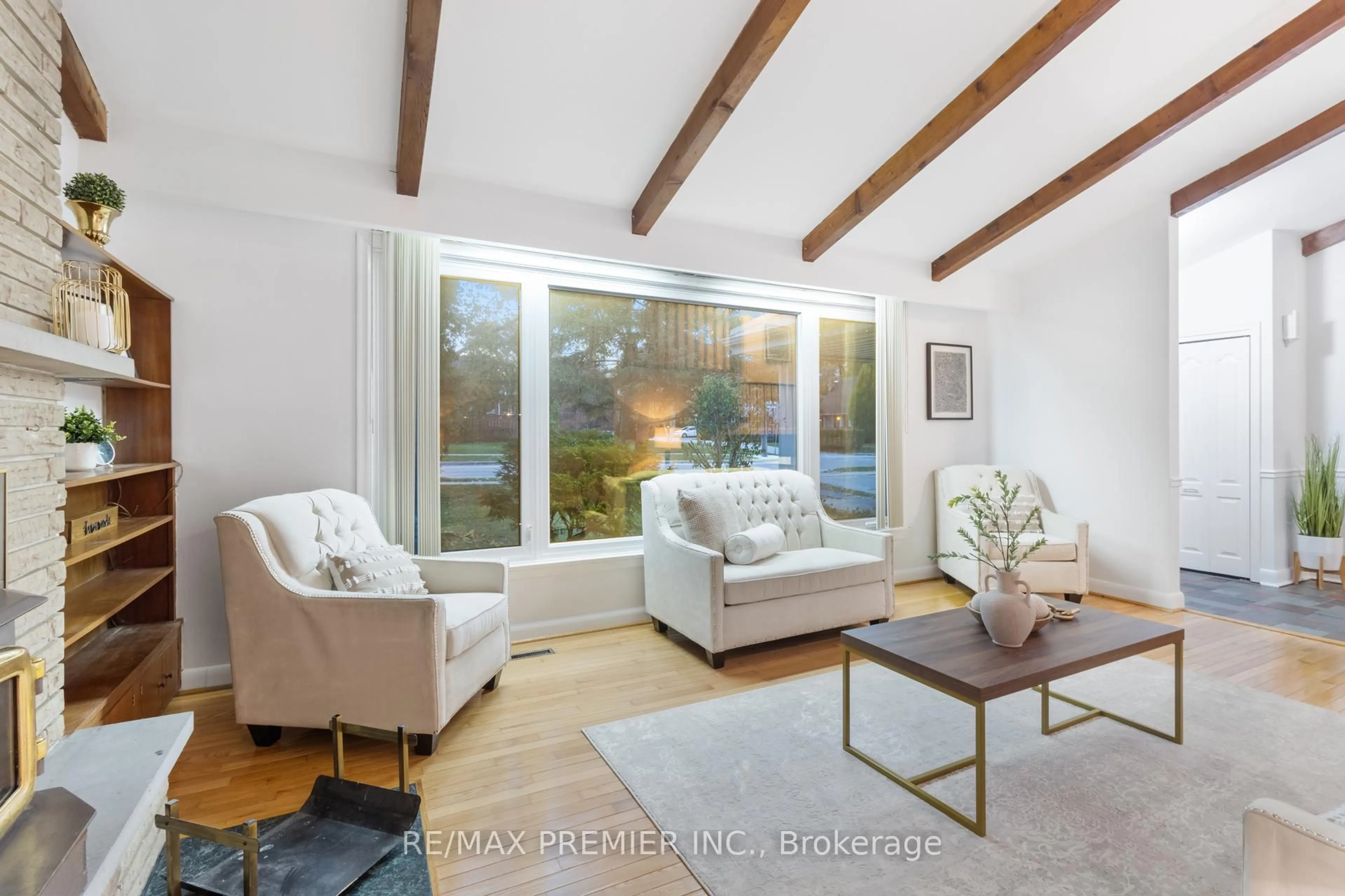 Living room with furniture, wood/laminate floor for 203 Martin Grove Rd, Toronto Ontario M9B 4L2