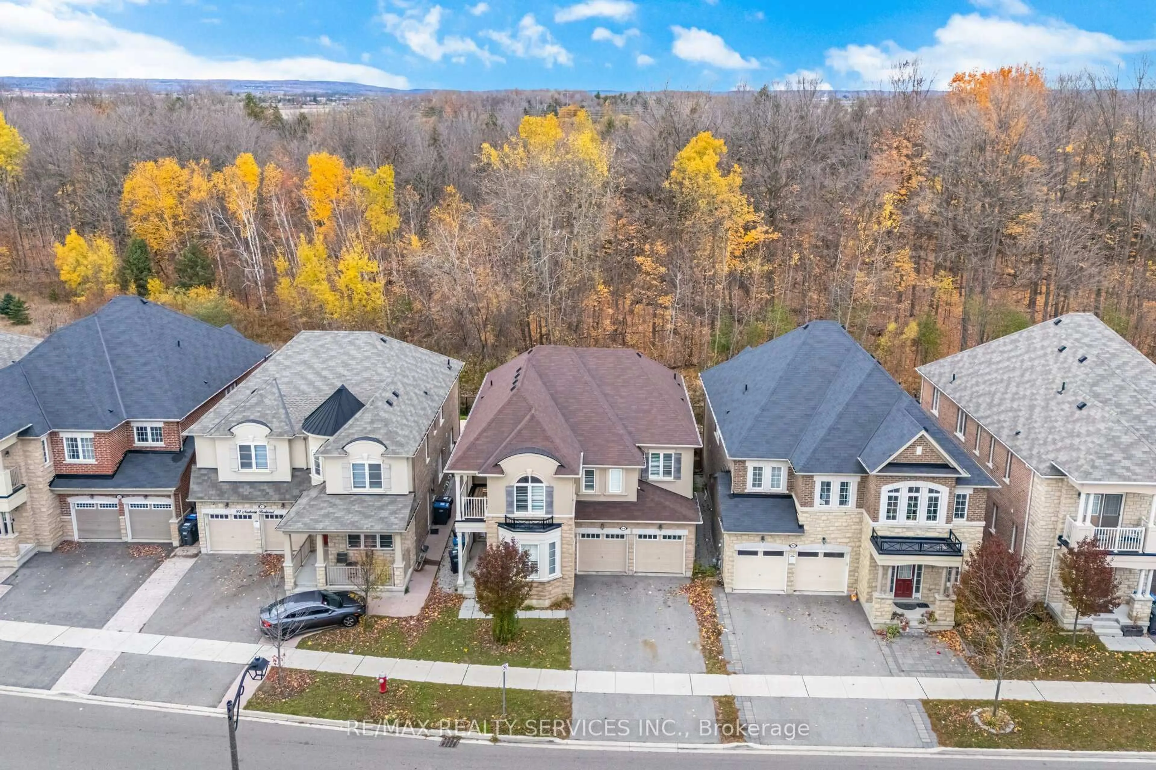A pic from outside/outdoor area/front of a property/back of a property/a pic from drone, street for 94 Newhouse Blvd, Caledon Ontario L7C 4E4