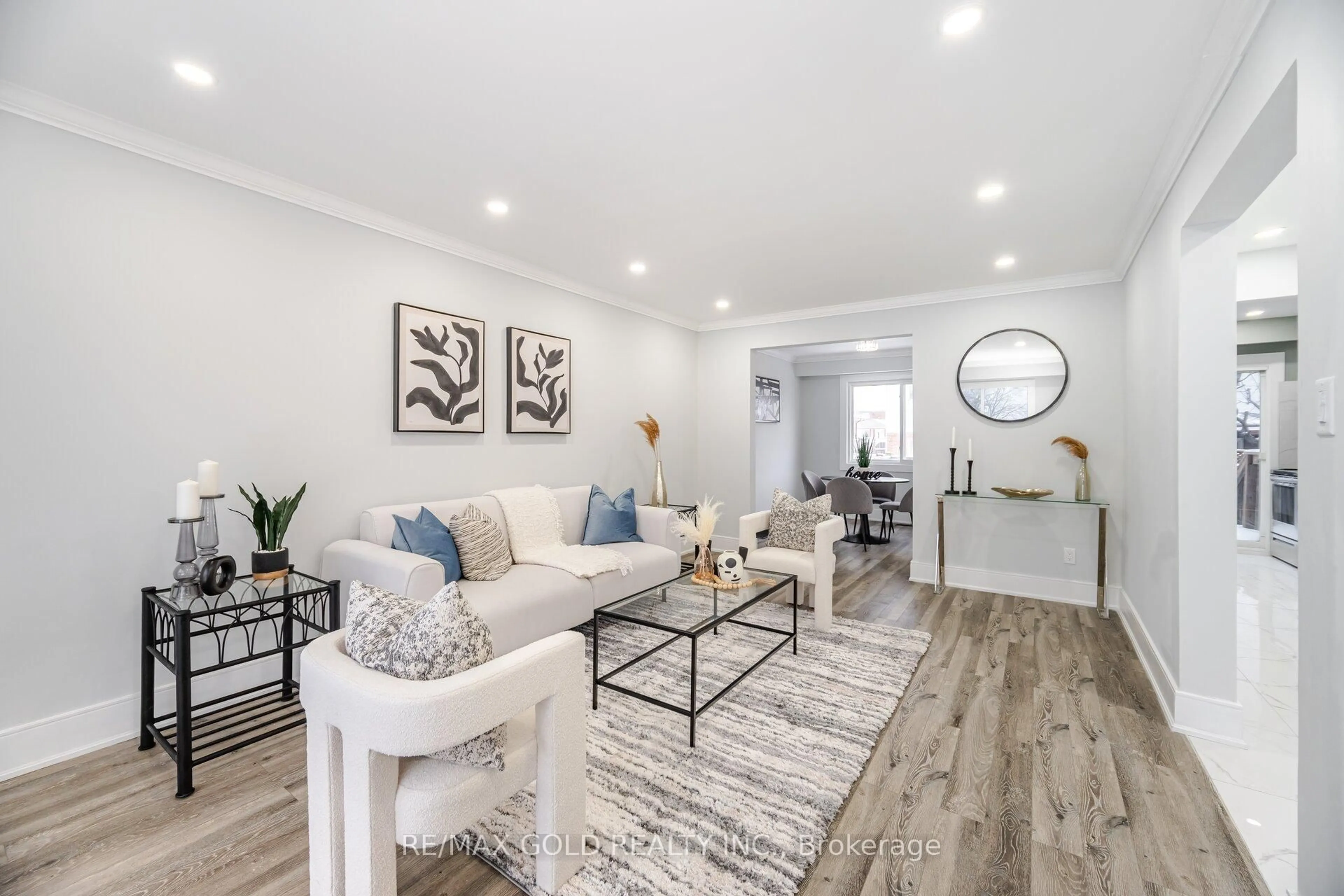 Living room with furniture, wood/laminate floor for 7500 Goreway Dr #62, Mississauga Ontario L4T 3C7