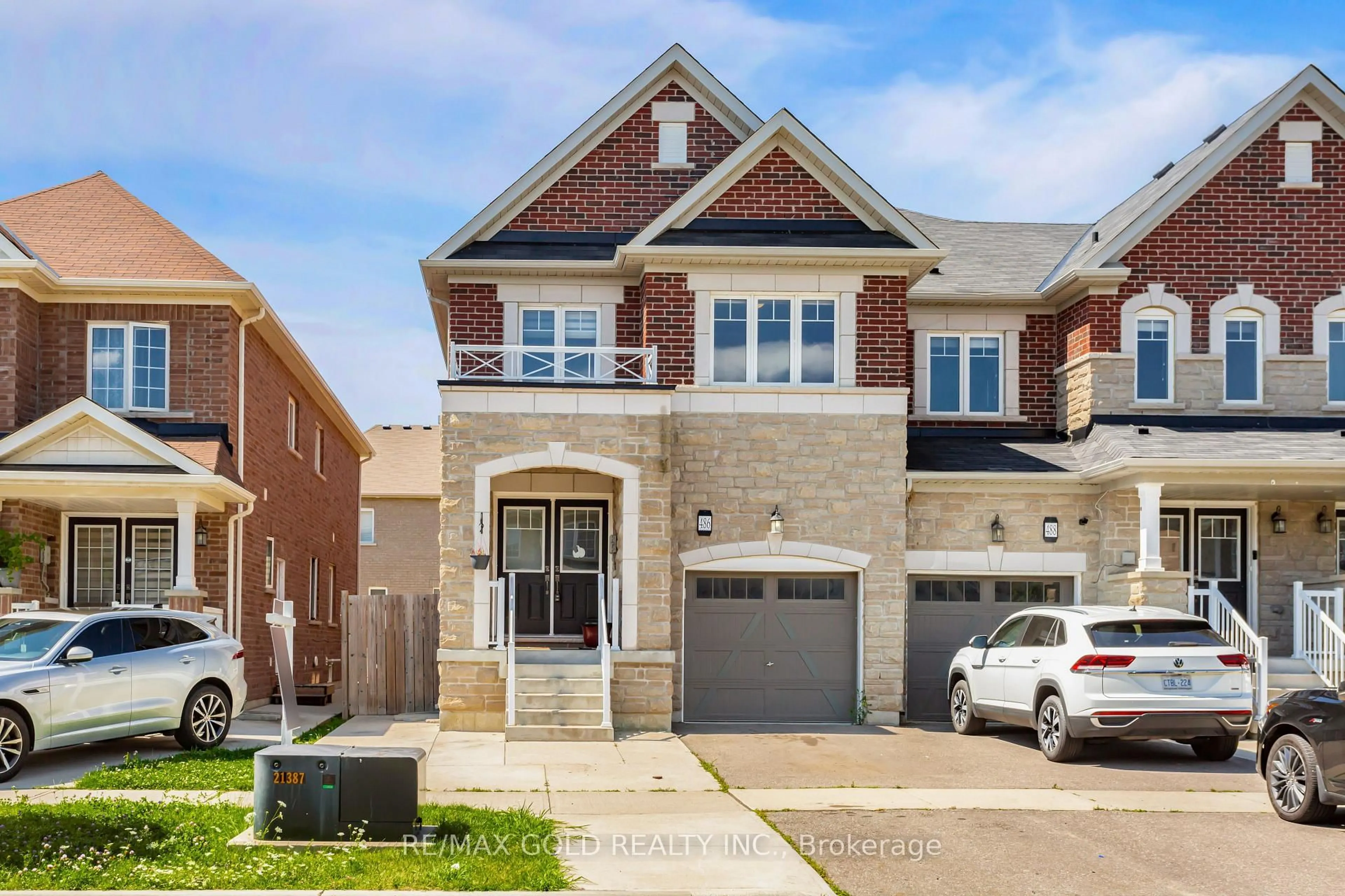 Home with brick exterior material, street for 486 Queen Mary Dr, Brampton Ontario L7A 4N3