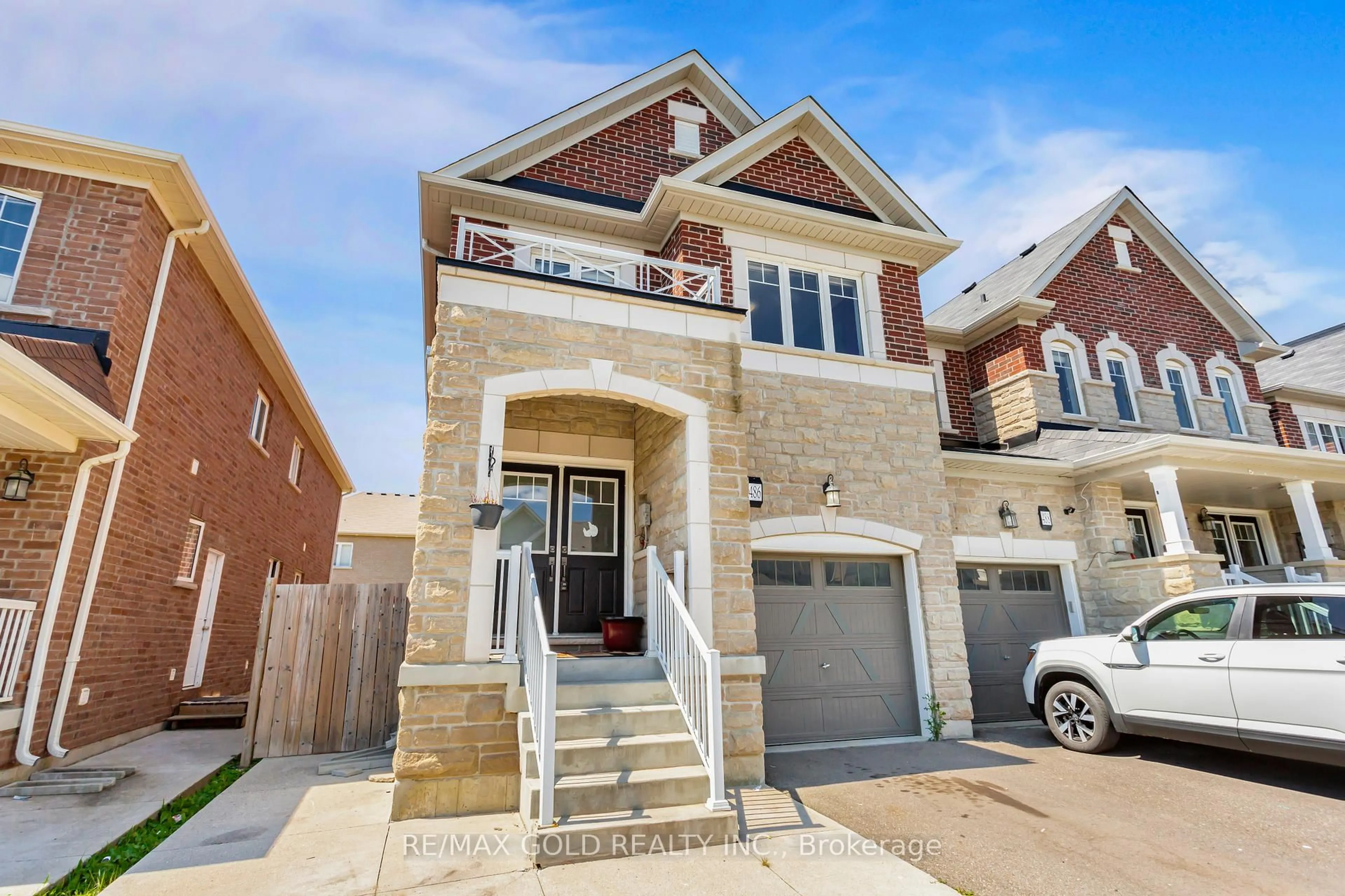 Home with brick exterior material, street for 486 Queen Mary Dr, Brampton Ontario L7A 4N3