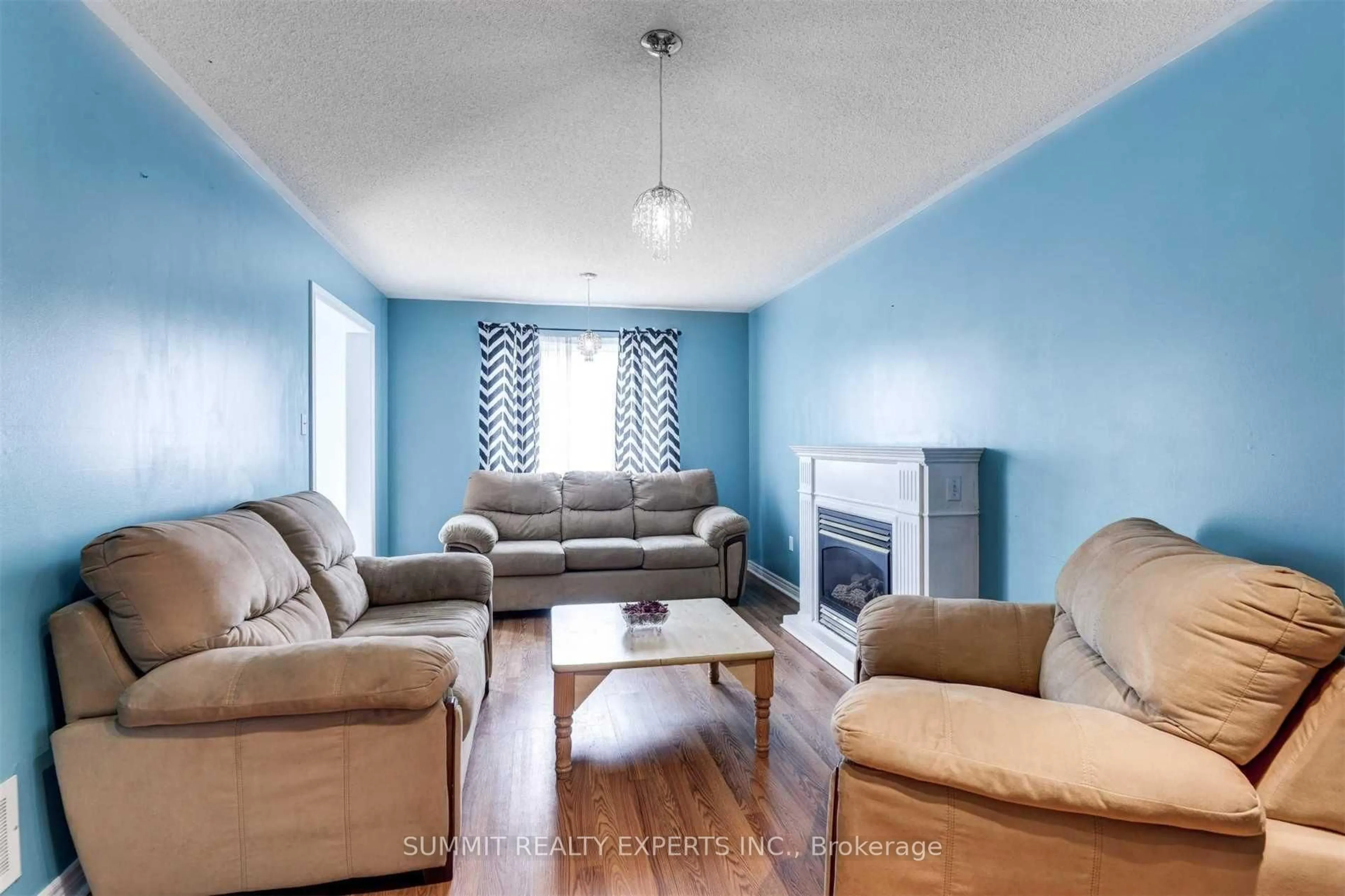 Living room with furniture, wood/laminate floor for 26 Great Plains St, Brampton Ontario L6R 1Z5