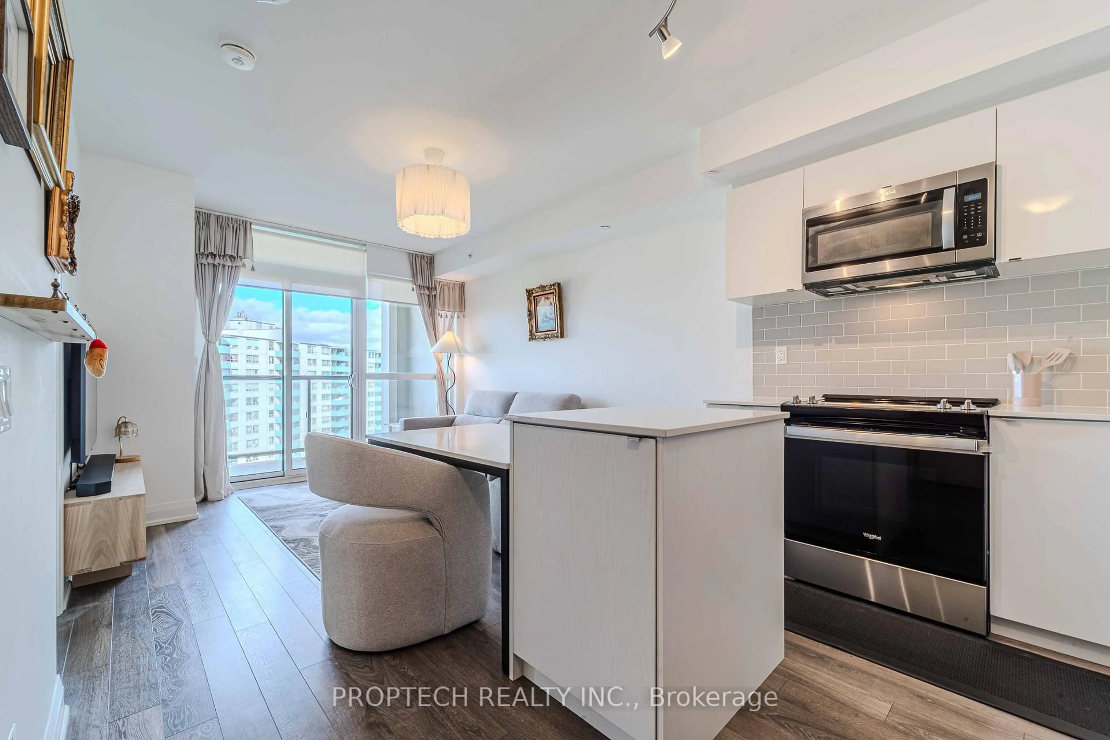 Open concept kitchen, wood/laminate floor for 1461 Lawrence Ave #1103, Toronto Ontario M6L 0A6