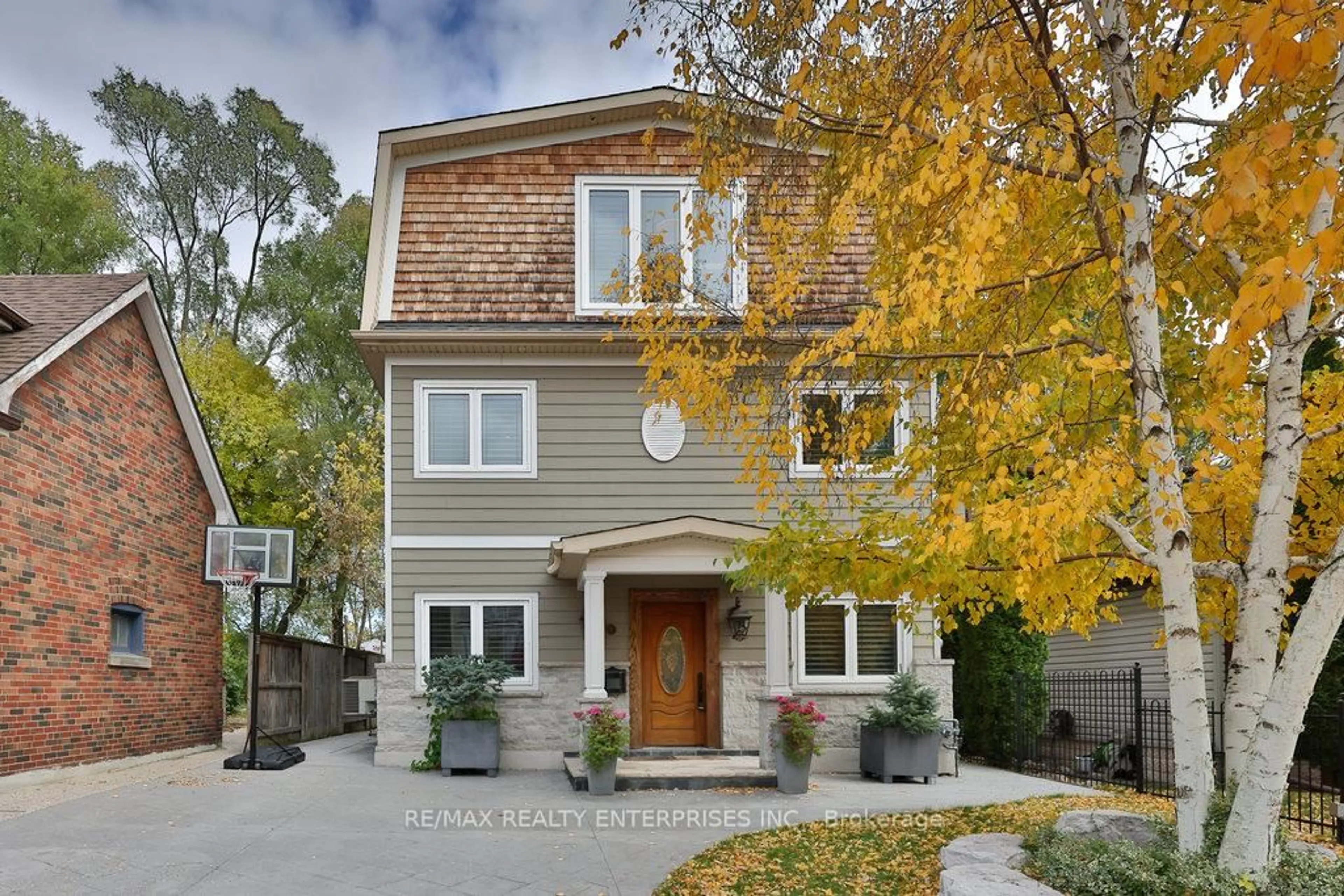 Home with brick exterior material, street for 11 Woodford Park Rd, Toronto Ontario M8Y 3E7