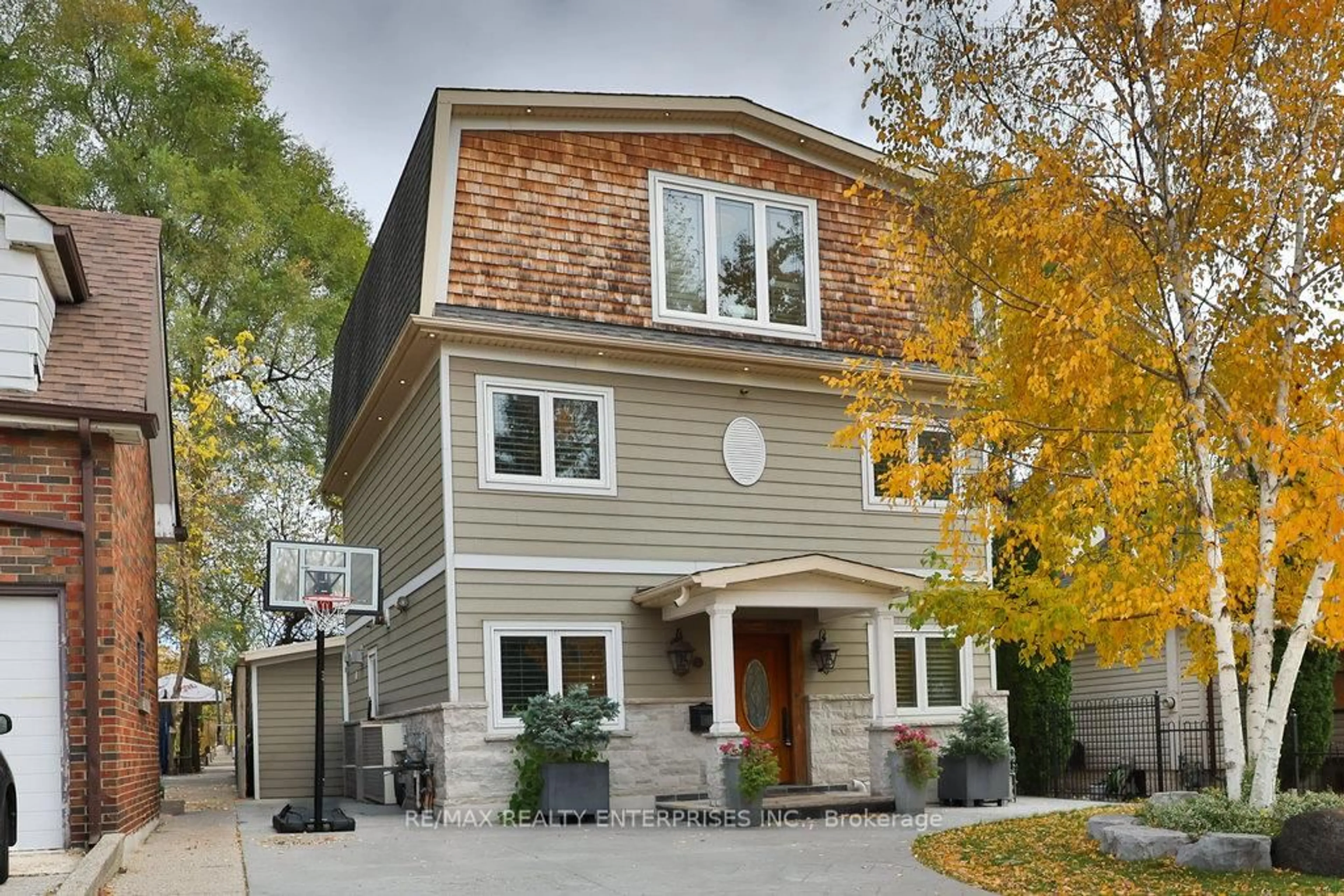 Home with brick exterior material, street for 11 Woodford Park Rd, Toronto Ontario M8Y 3E7