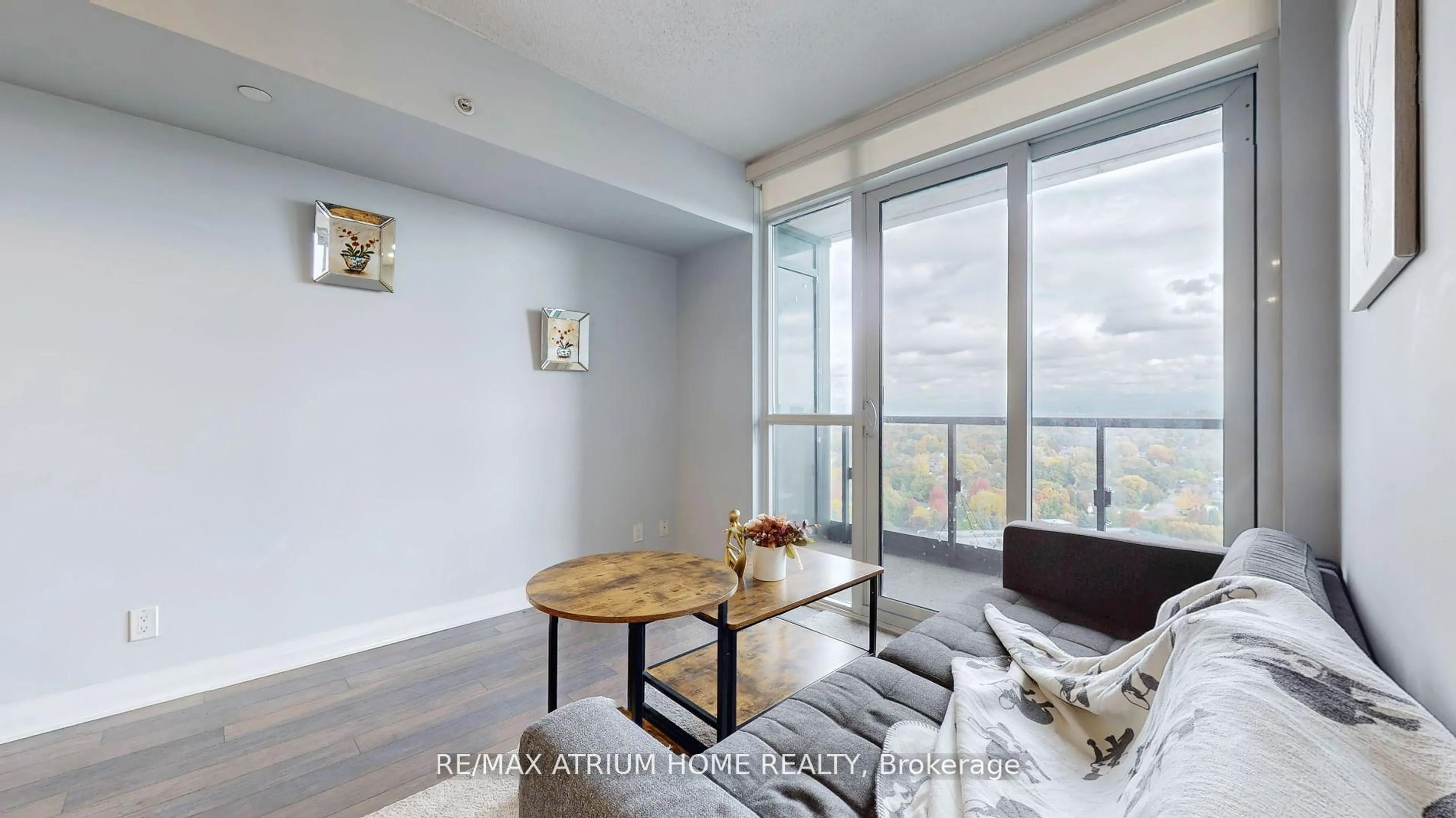 Living room with furniture, wood/laminate floor for 5 Valhalla Inn Rd #1803, Toronto Ontario M9B 0B1