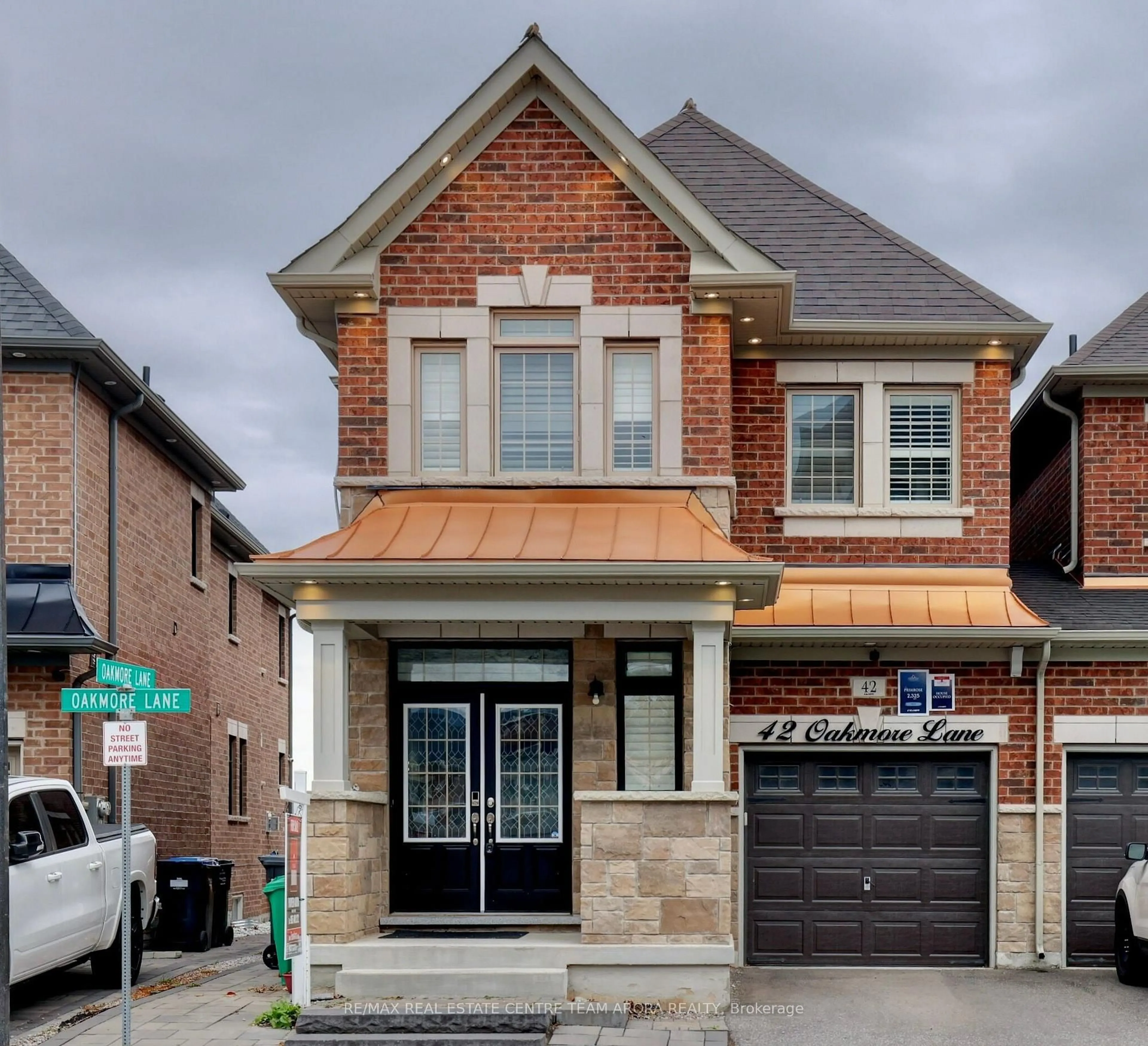 Home with brick exterior material, street for 42 OAKMORE Lane, Brampton Ontario L6Y 6H5