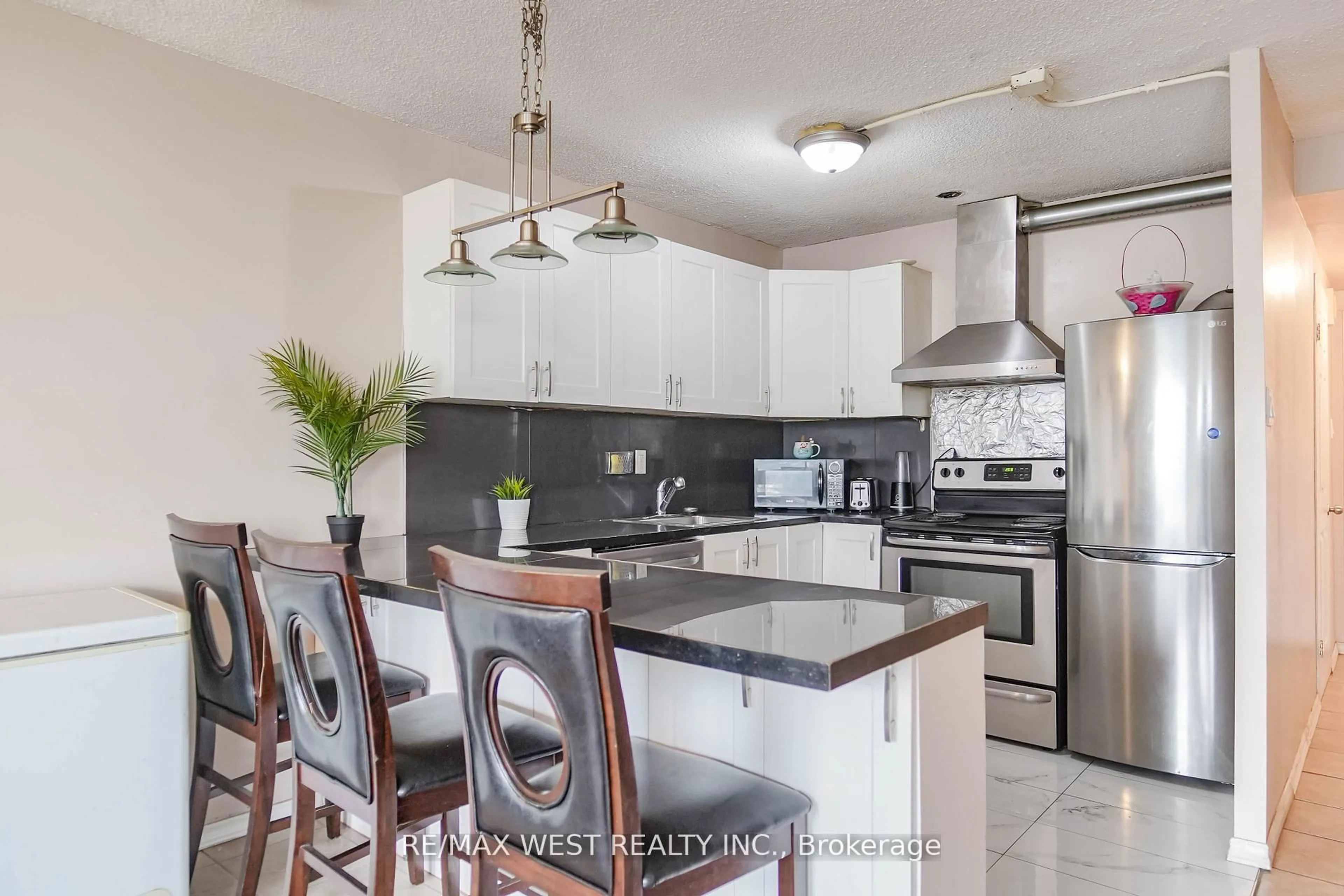 Open concept kitchen, ceramic/tile floor for 40 Panorama Crt #408, Toronto Ontario M9V 4M1