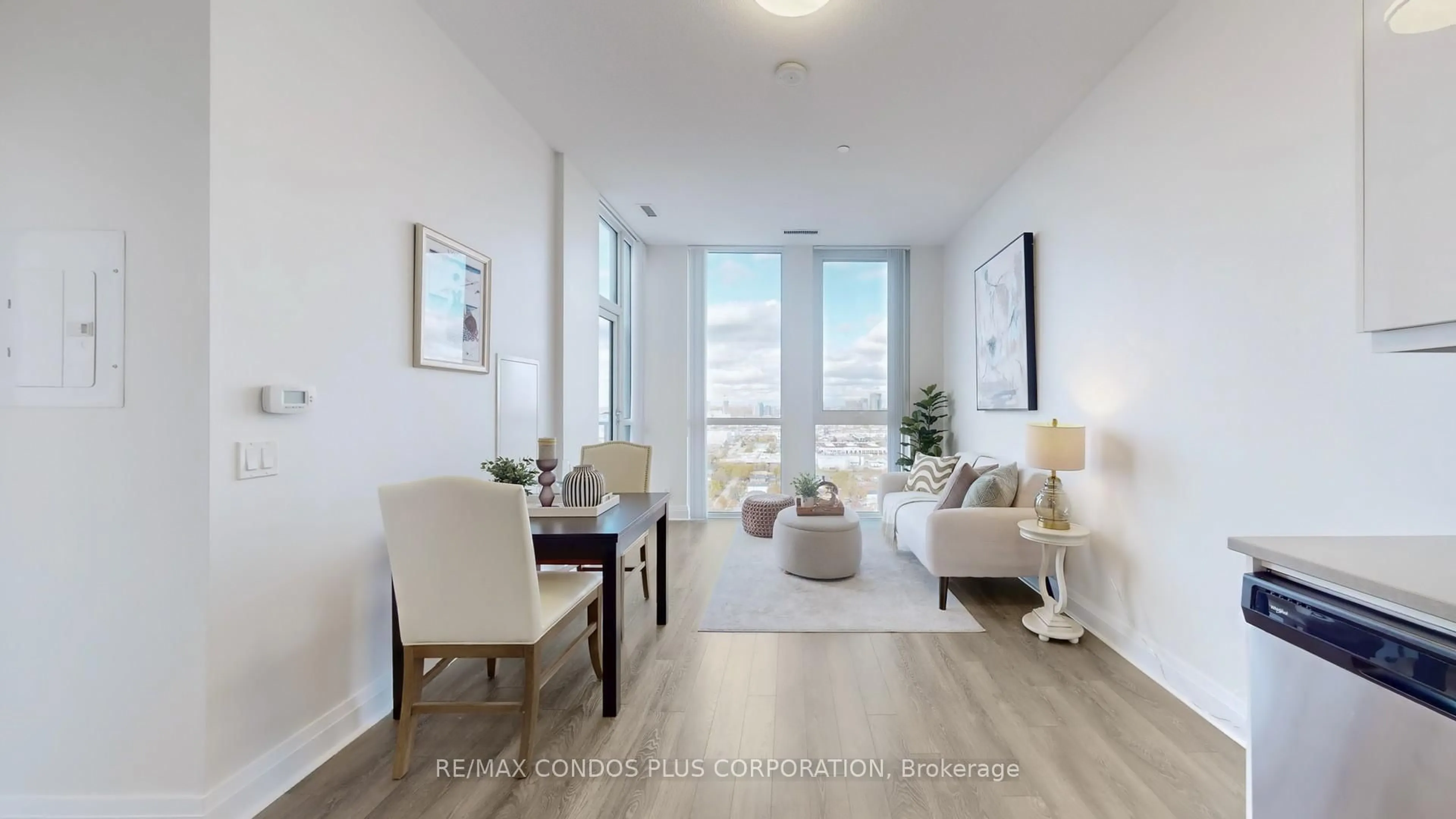 Living room with furniture, wood/laminate floor for 17 Zorra St #2409, Toronto Ontario M8Z 0C8