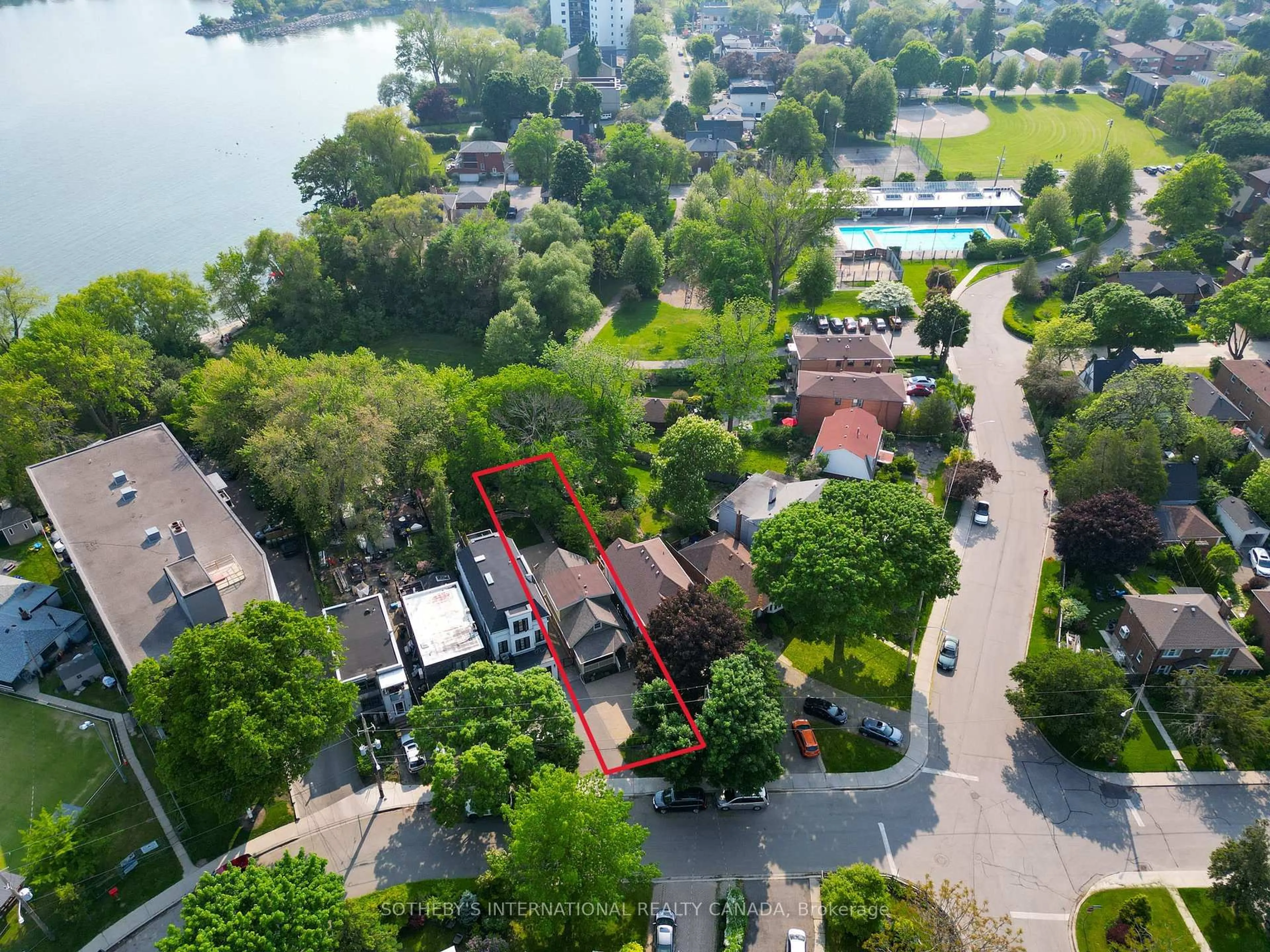 A pic from outside/outdoor area/front of a property/back of a property/a pic from drone, water/lake/river/ocean view for 165 Lake Shore Dr, Toronto Ontario M8V 2A1
