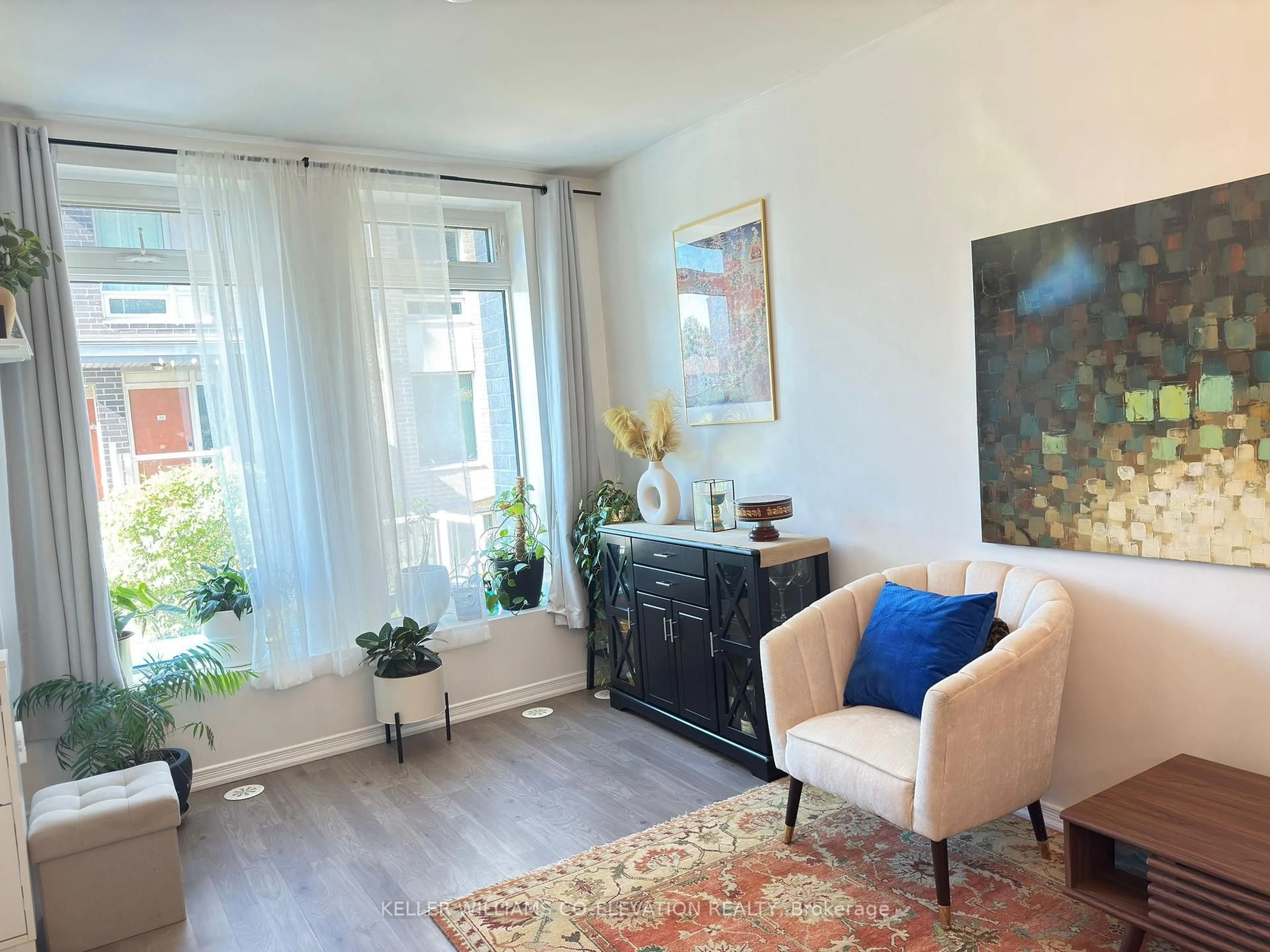 Living room with furniture, wood/laminate floor for 11 Applewood Lane #112, Toronto Ontario M9C 2Z7