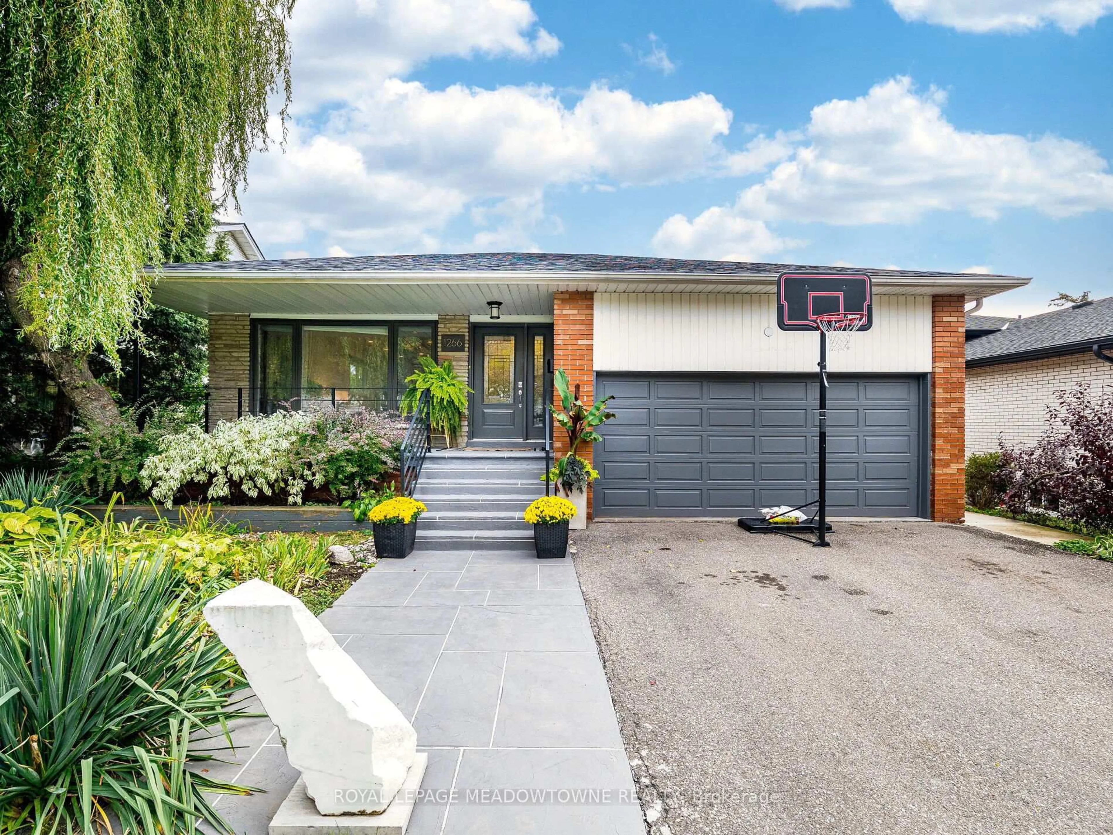 Home with brick exterior material, street for 1266 Winding Tr, Mississauga Ontario L4Y 2T7