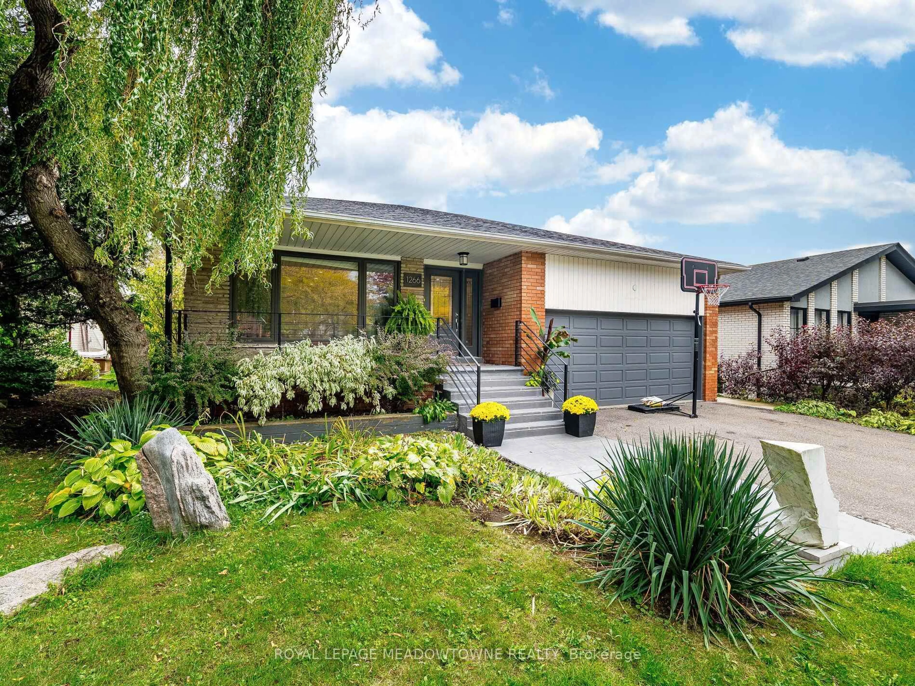 Home with brick exterior material, street for 1266 Winding Tr, Mississauga Ontario L4Y 2T7