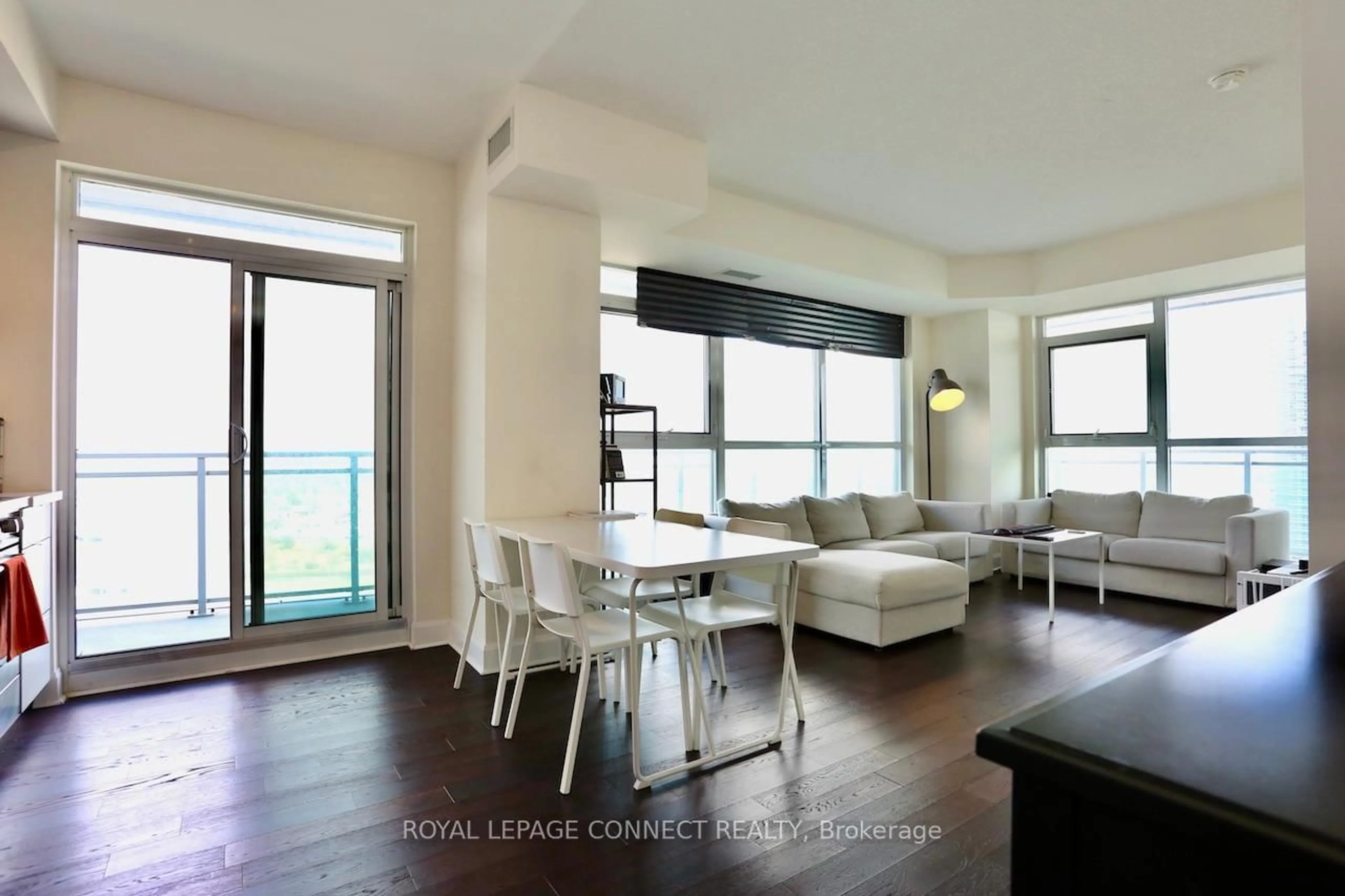 Living room with furniture, wood/laminate floor for 33 Shore Breeze Dr #2504, Toronto Ontario M8V 1A1