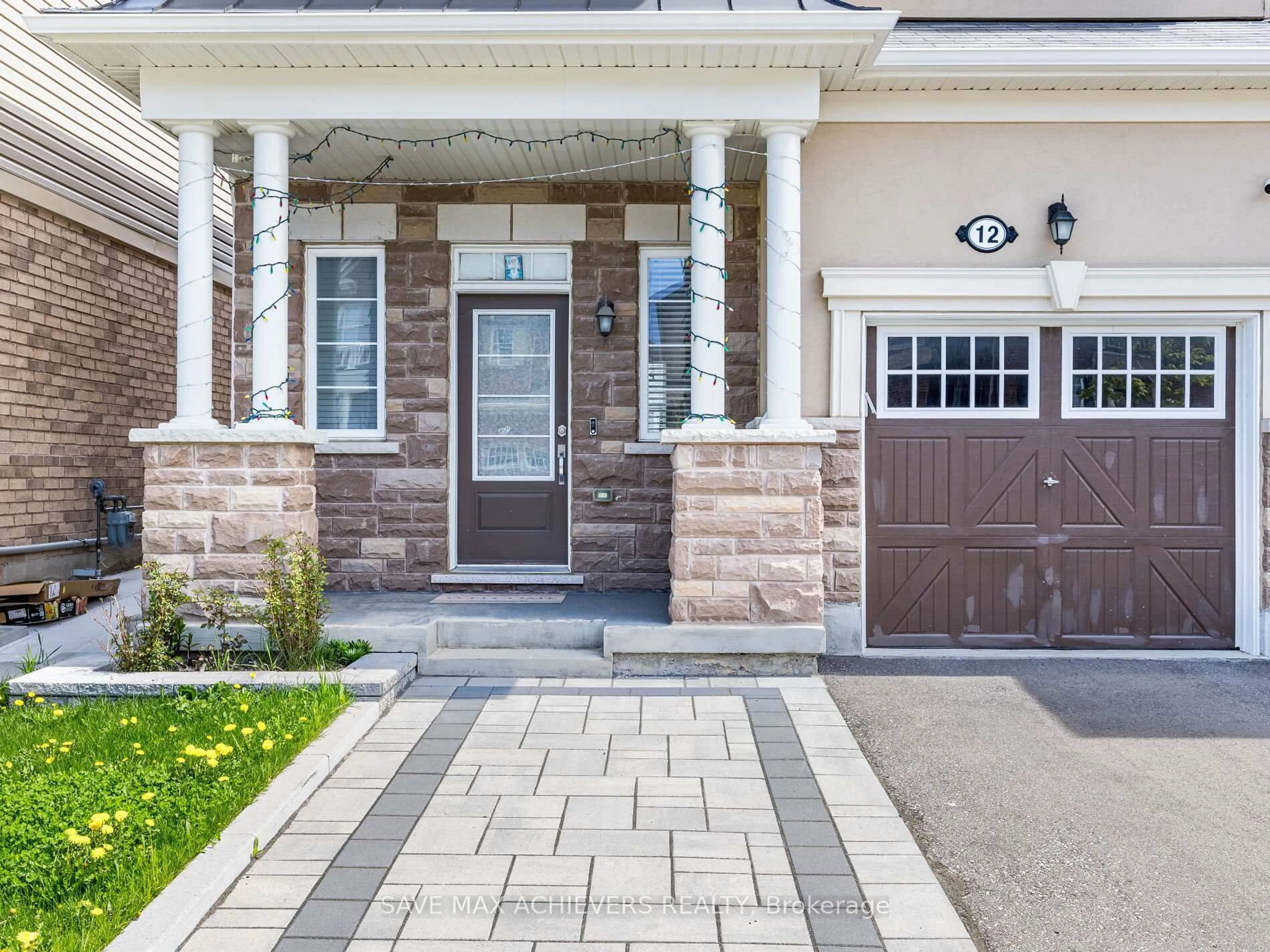 Home with brick exterior material, street for 12 Emerald Coast Tr, Brampton Ontario L7A 5A7