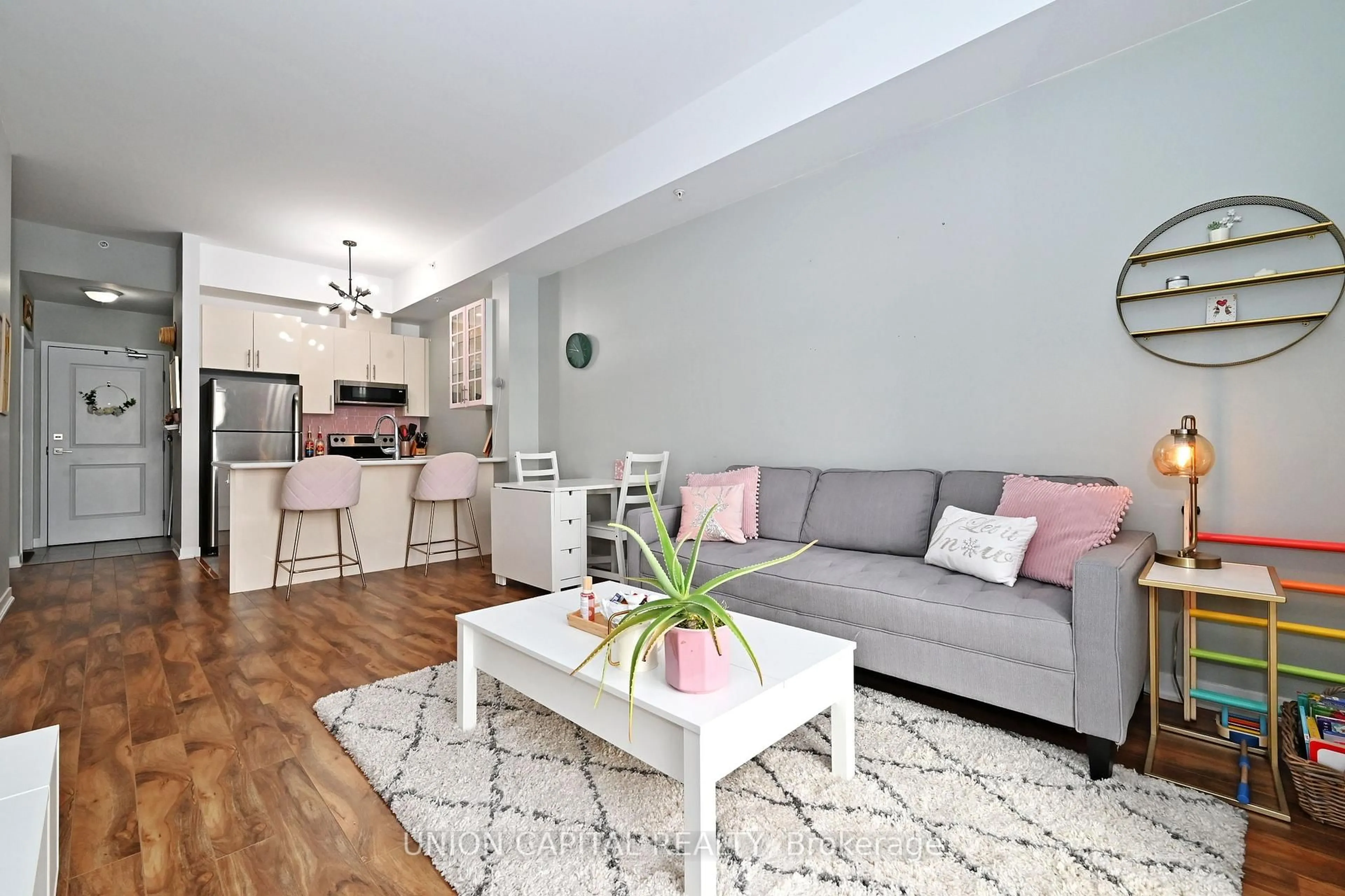 Living room with furniture, wood/laminate floor for 5010 Corporate Dr #428, Burlington Ontario L7L 0H6