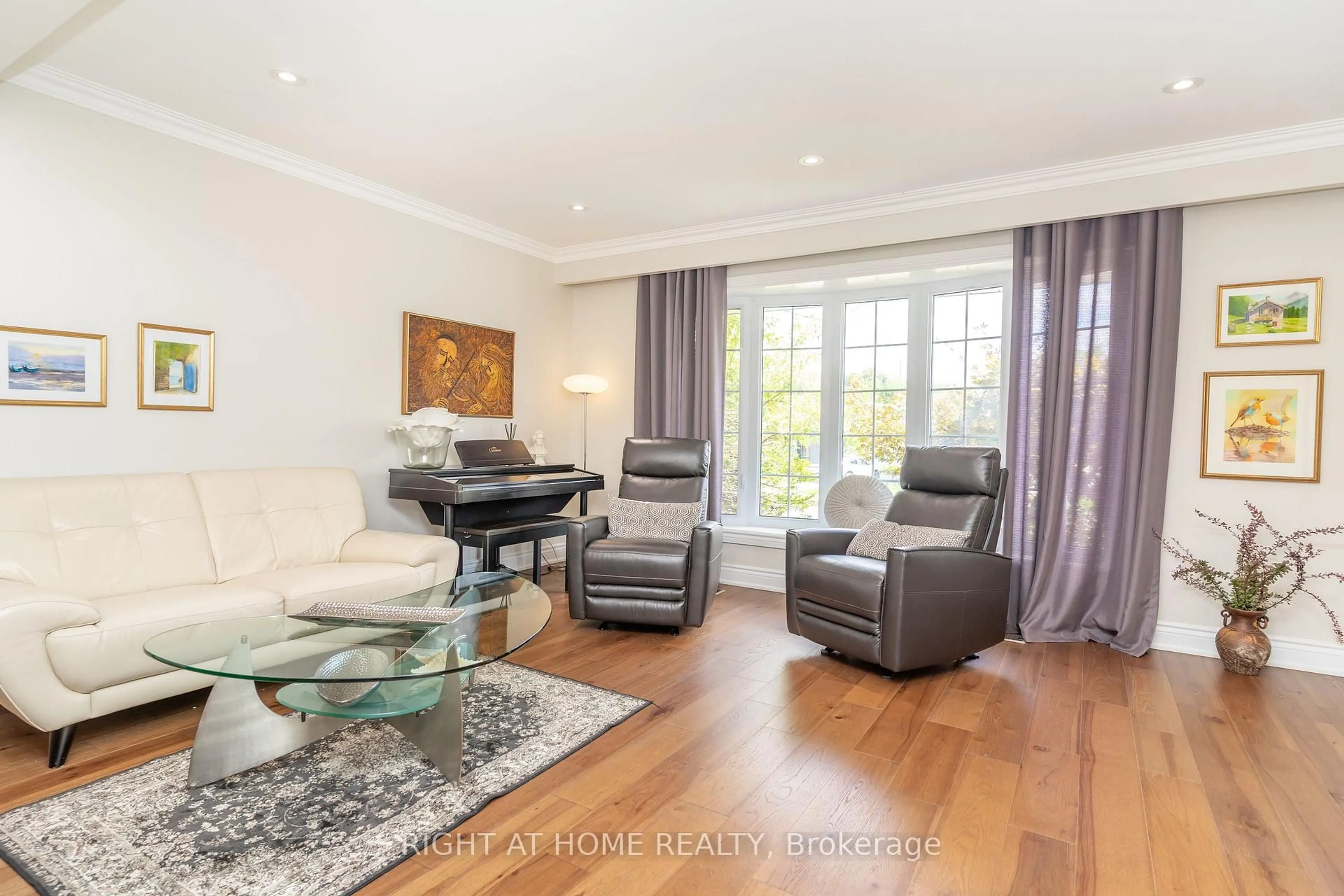 Living room with furniture, wood/laminate floor for 63 Allonsius Dr, Toronto Ontario M9C 3N6