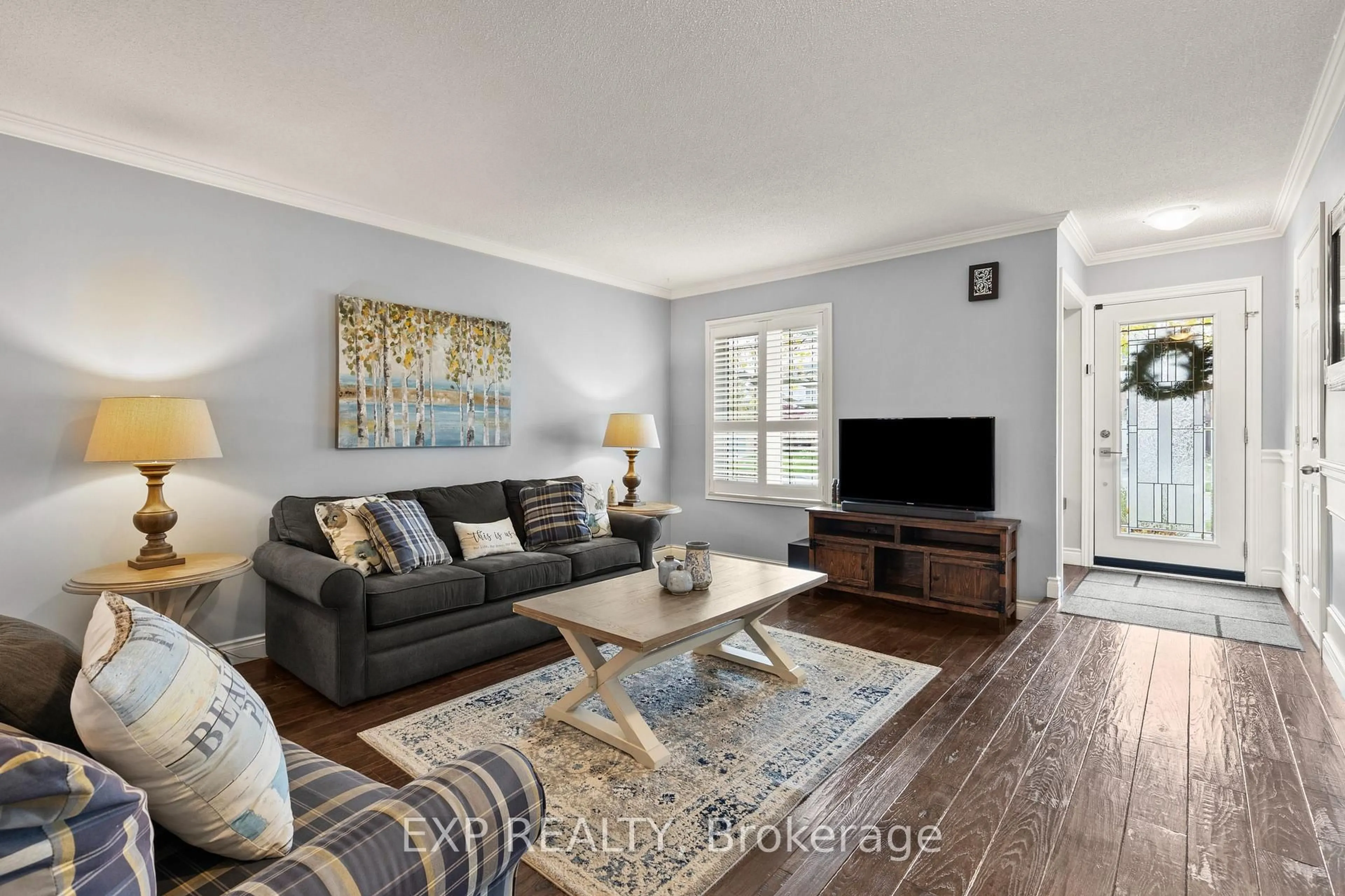 Living room with furniture, wood/laminate floor for 2203 Hunt Cres, Burlington Ontario L7M 3E3