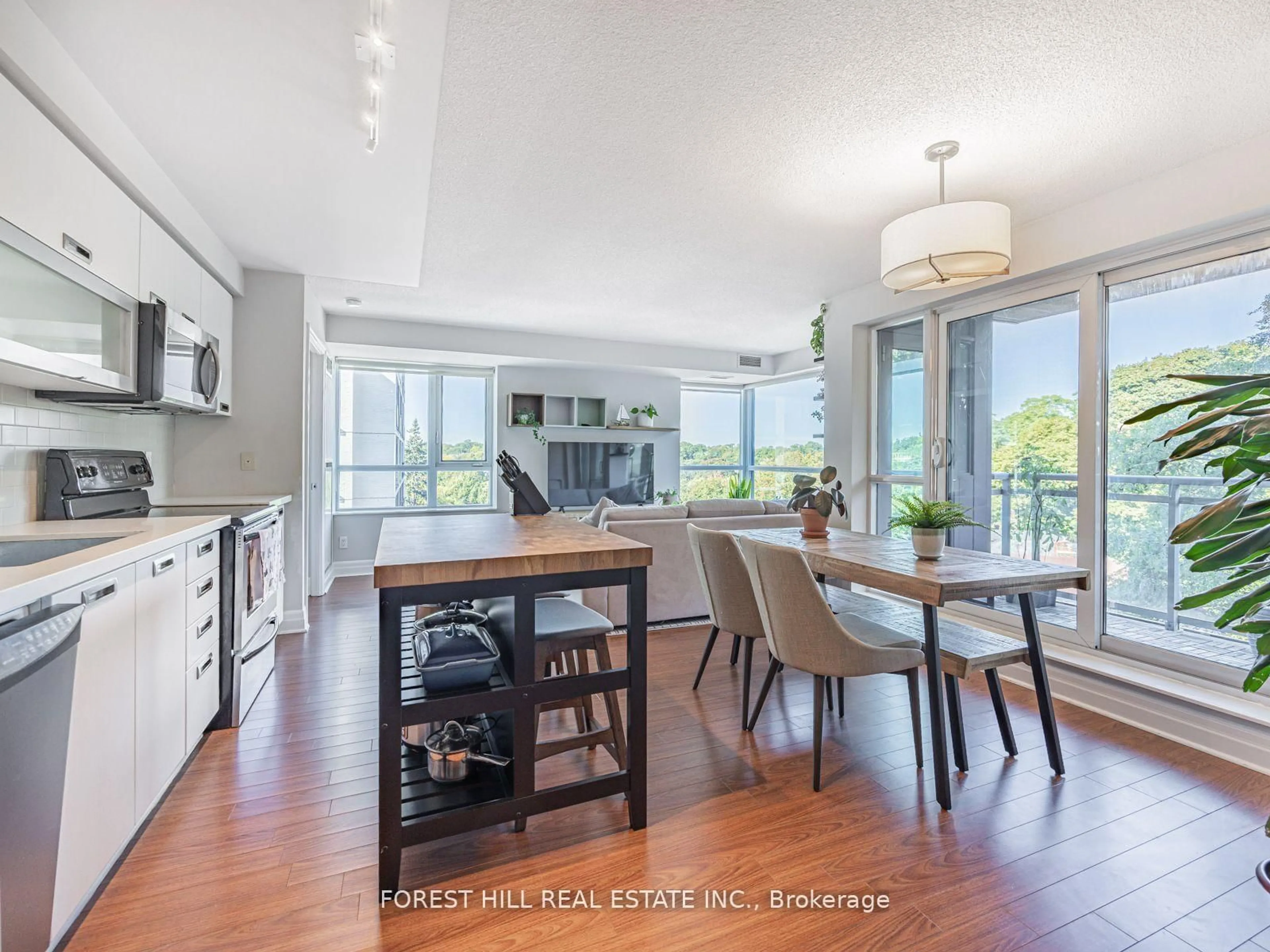 Open concept kitchen, wood/laminate floor for 20 Gothic Ave #216, Toronto Ontario M6P 1T5