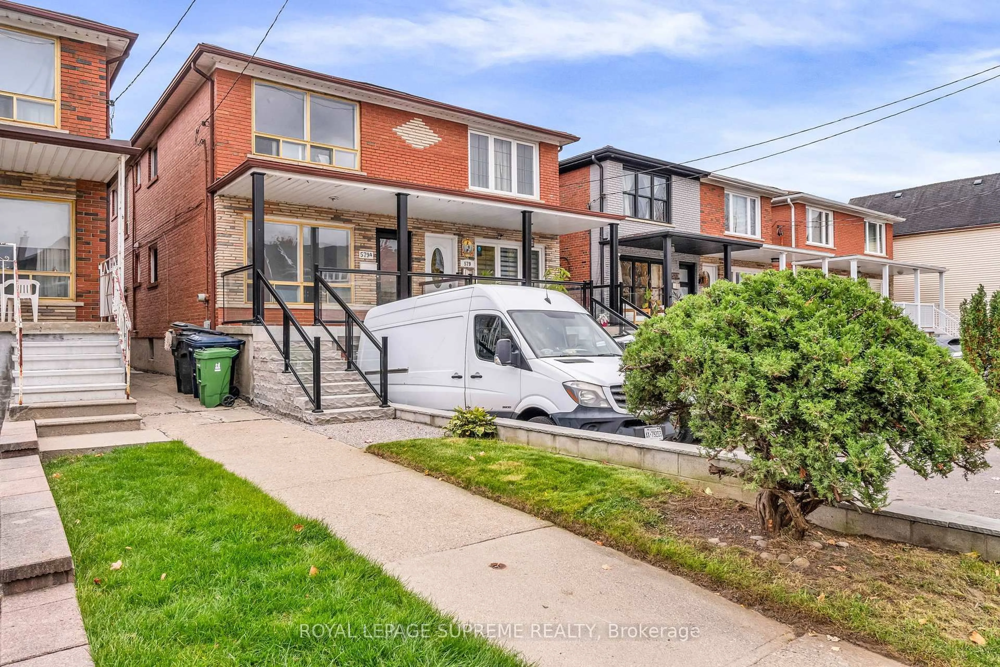 Home with brick exterior material, street for 579A Delaware Ave, Toronto Ontario M6H 5V3