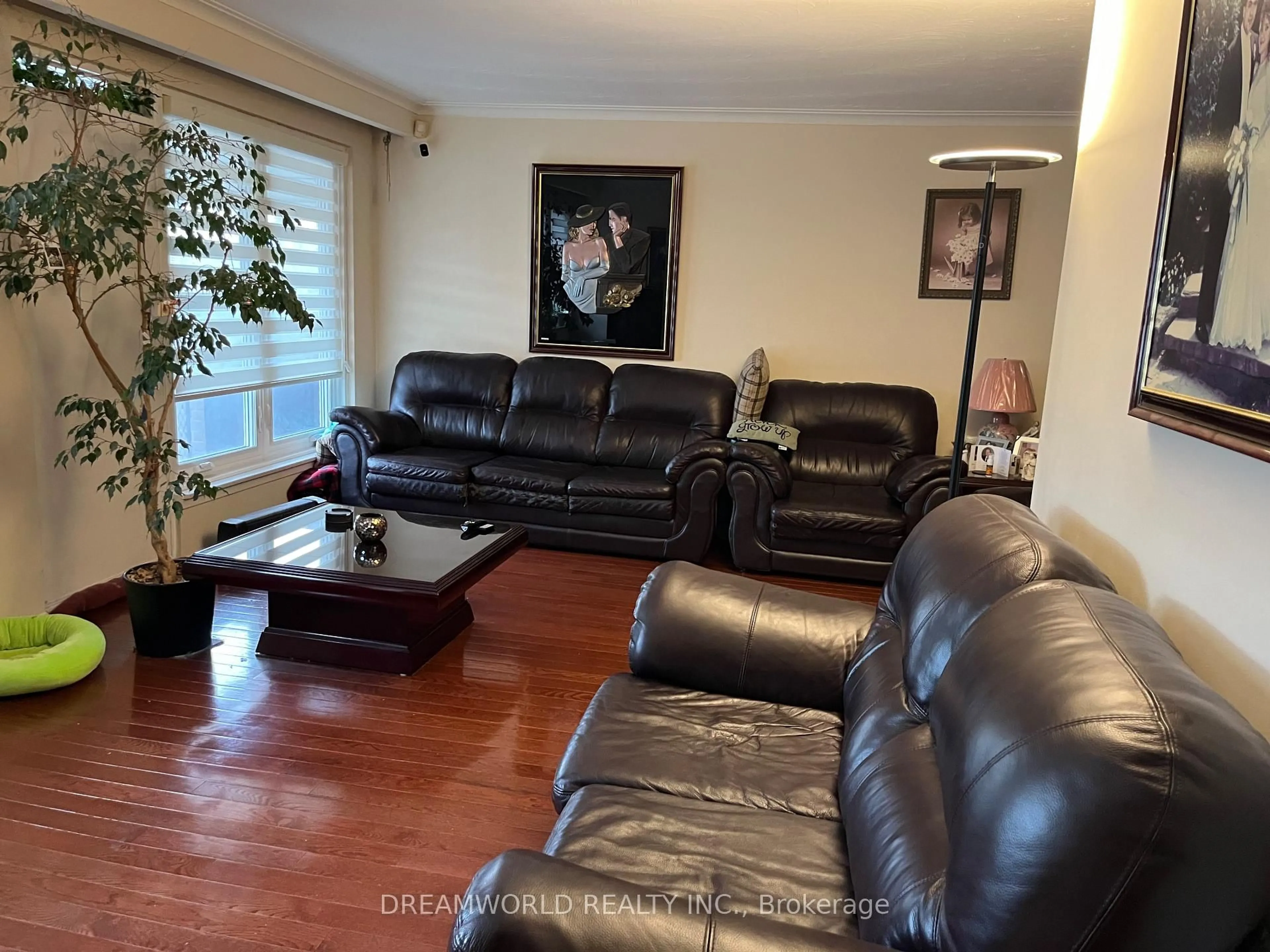 Living room with furniture, wood/laminate floor for 35 Cobb Ave, Toronto Ontario M3L 2A2