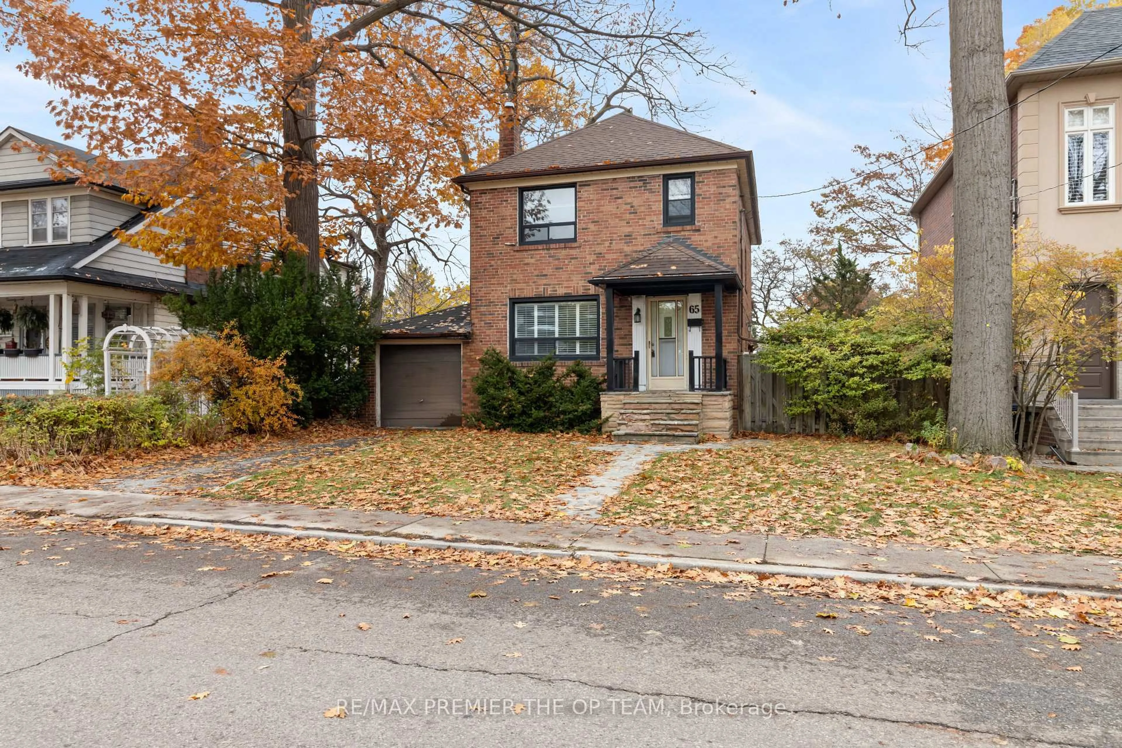 Home with brick exterior material, street for 65 Long Branch Ave, Toronto Ontario M8W 3J3