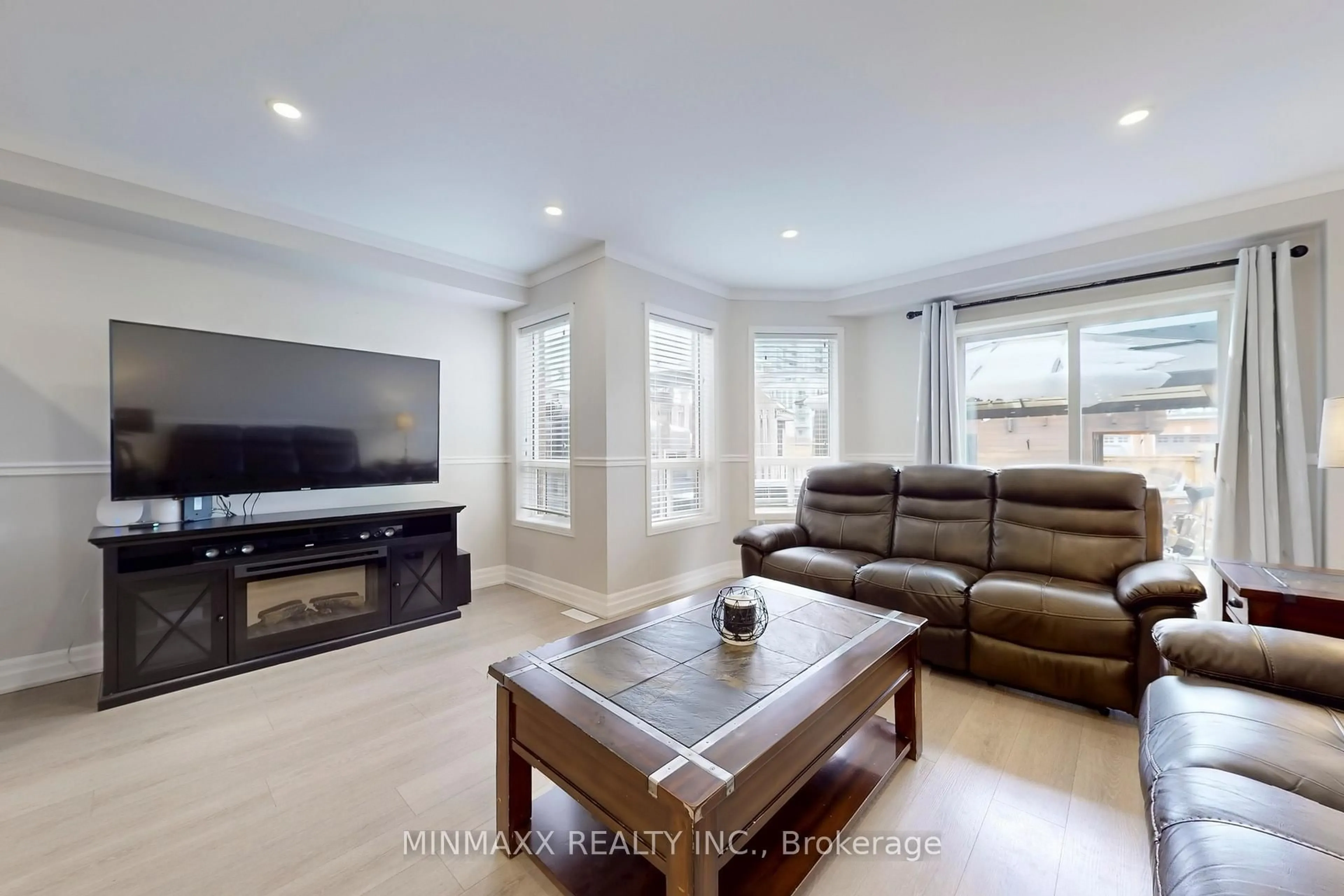 Living room with furniture, wood/laminate floor for 1022 Borden Lane, Milton Ontario L9T 5N9