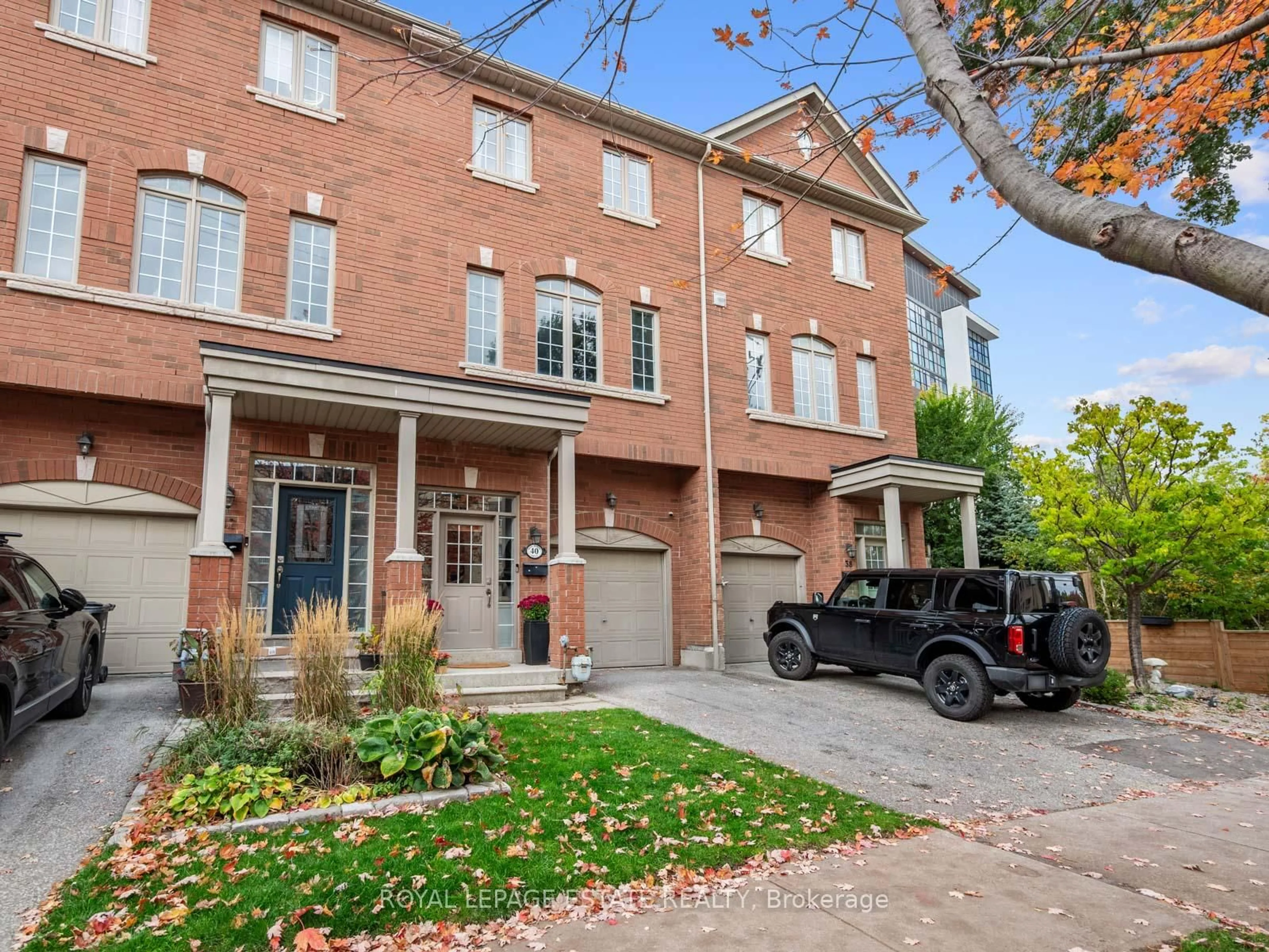 Home with brick exterior material, street for 40 Bell Manor Dr, Toronto Ontario M8Y 0A4