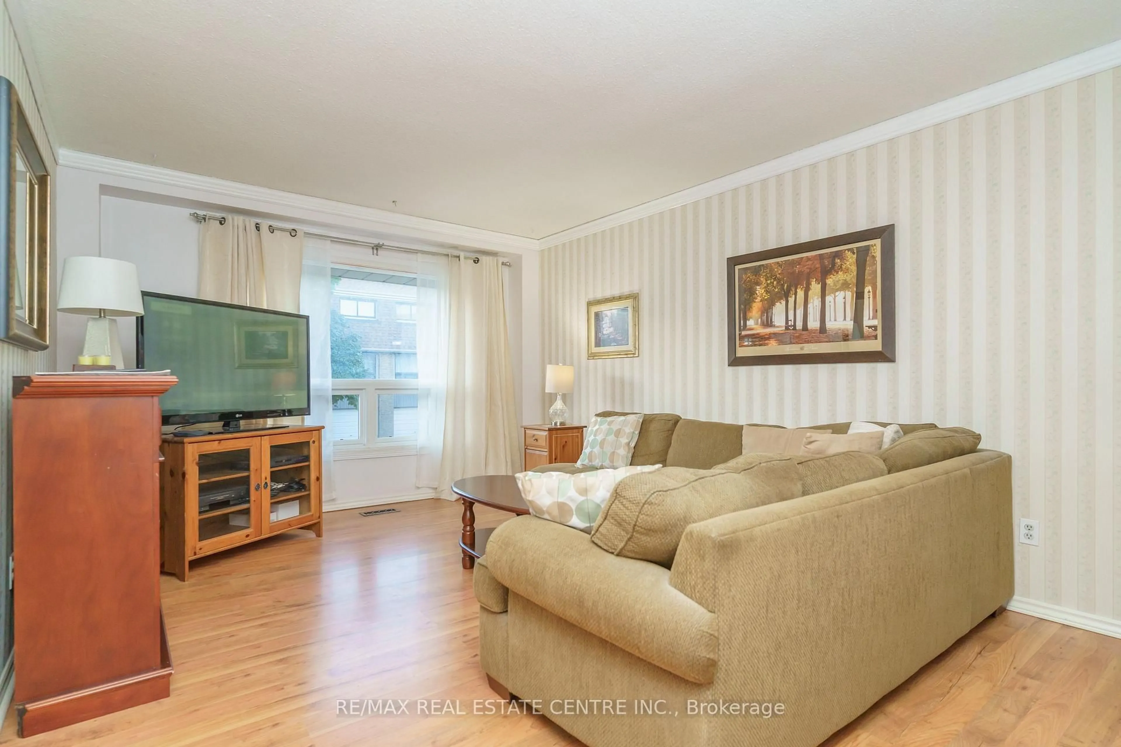 Living room with furniture, wood/laminate floor for 143 Ashton Cres #143, Brampton Ontario L6S 3J9