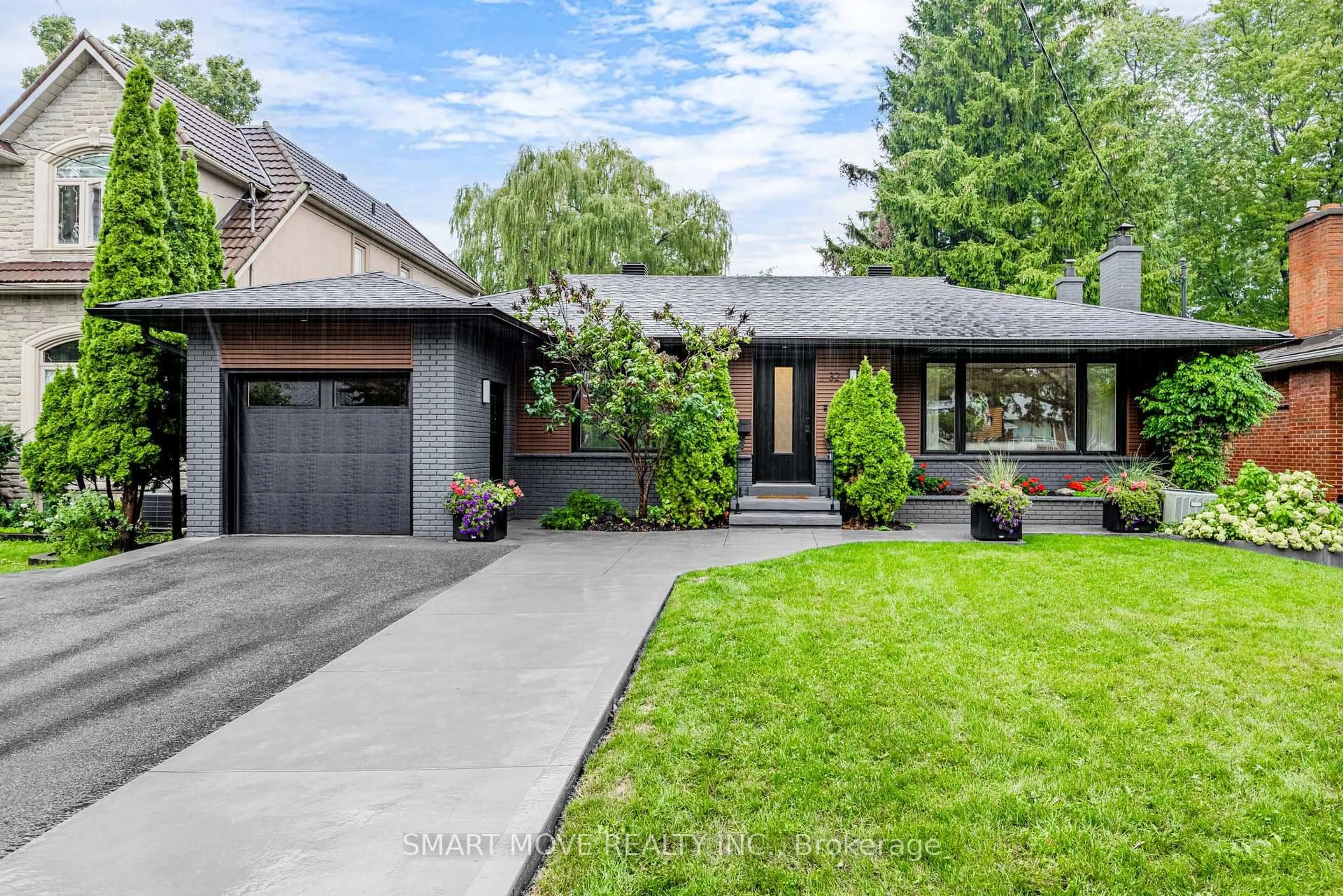 Home with brick exterior material, street for 32 Burnelm Dr, Toronto Ontario M9B 4N3