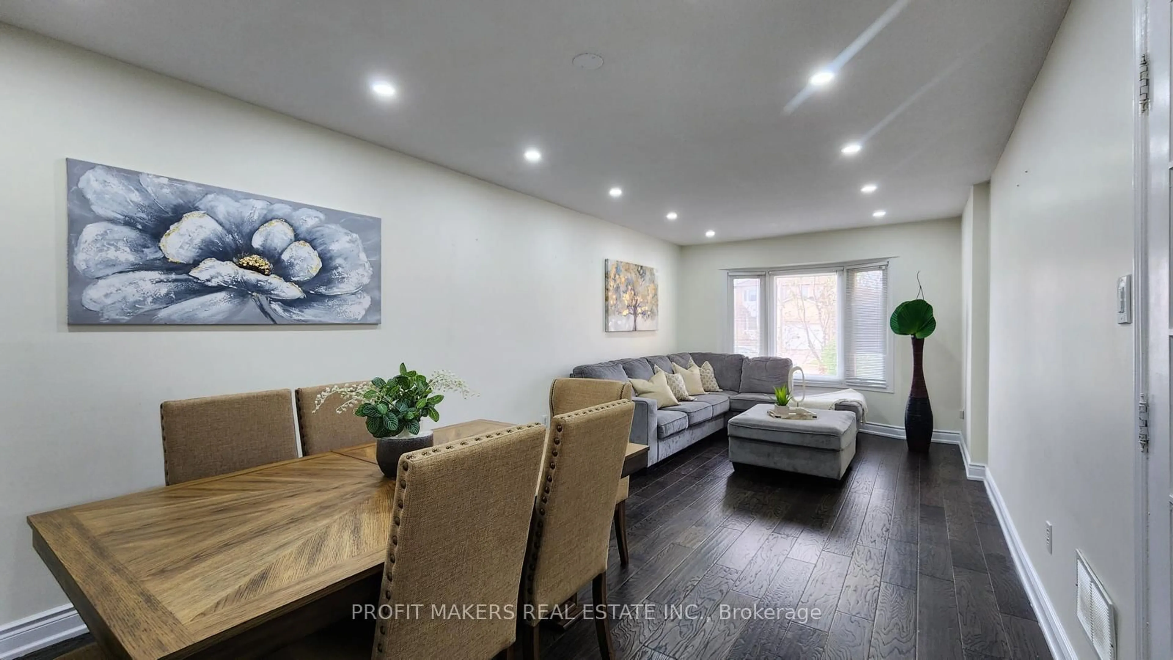 Living room with furniture, wood/laminate floor for 49 Horsham St, Brampton Ontario L6S 3R4