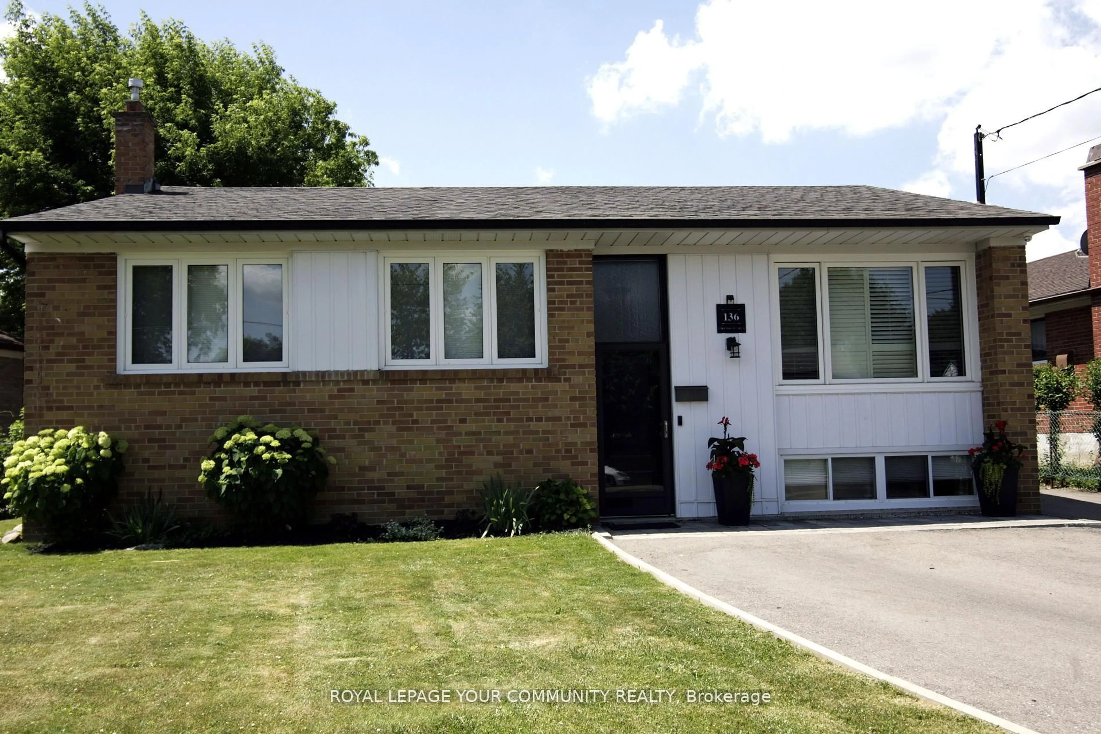 Home with vinyl exterior material, street for 136 Strathburn Blvd, Toronto Ontario M9M 2L1