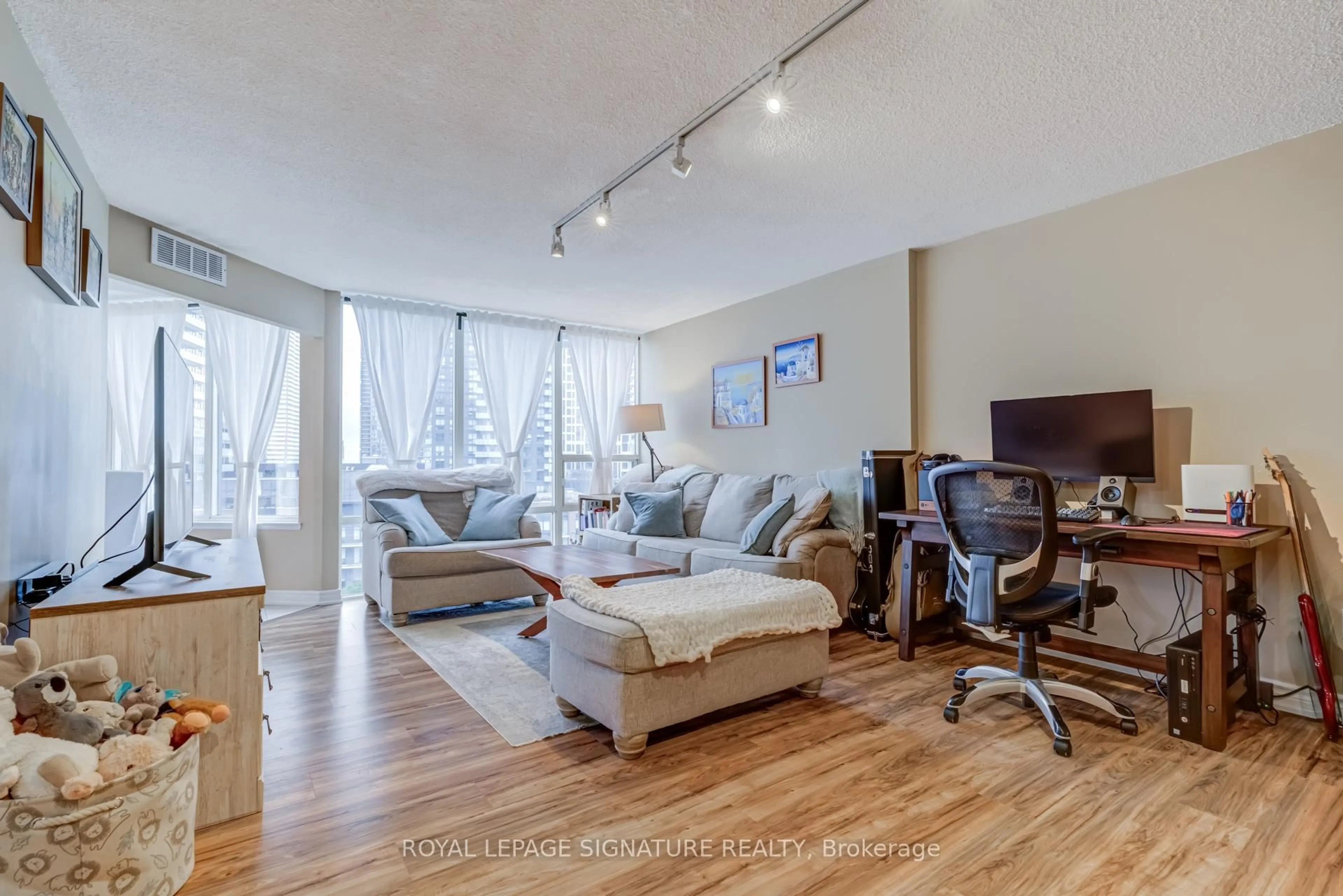 Living room with furniture, wood/laminate floor for 350 Rathburn Rd #1001, Mississauga Ontario L5B 3Y2