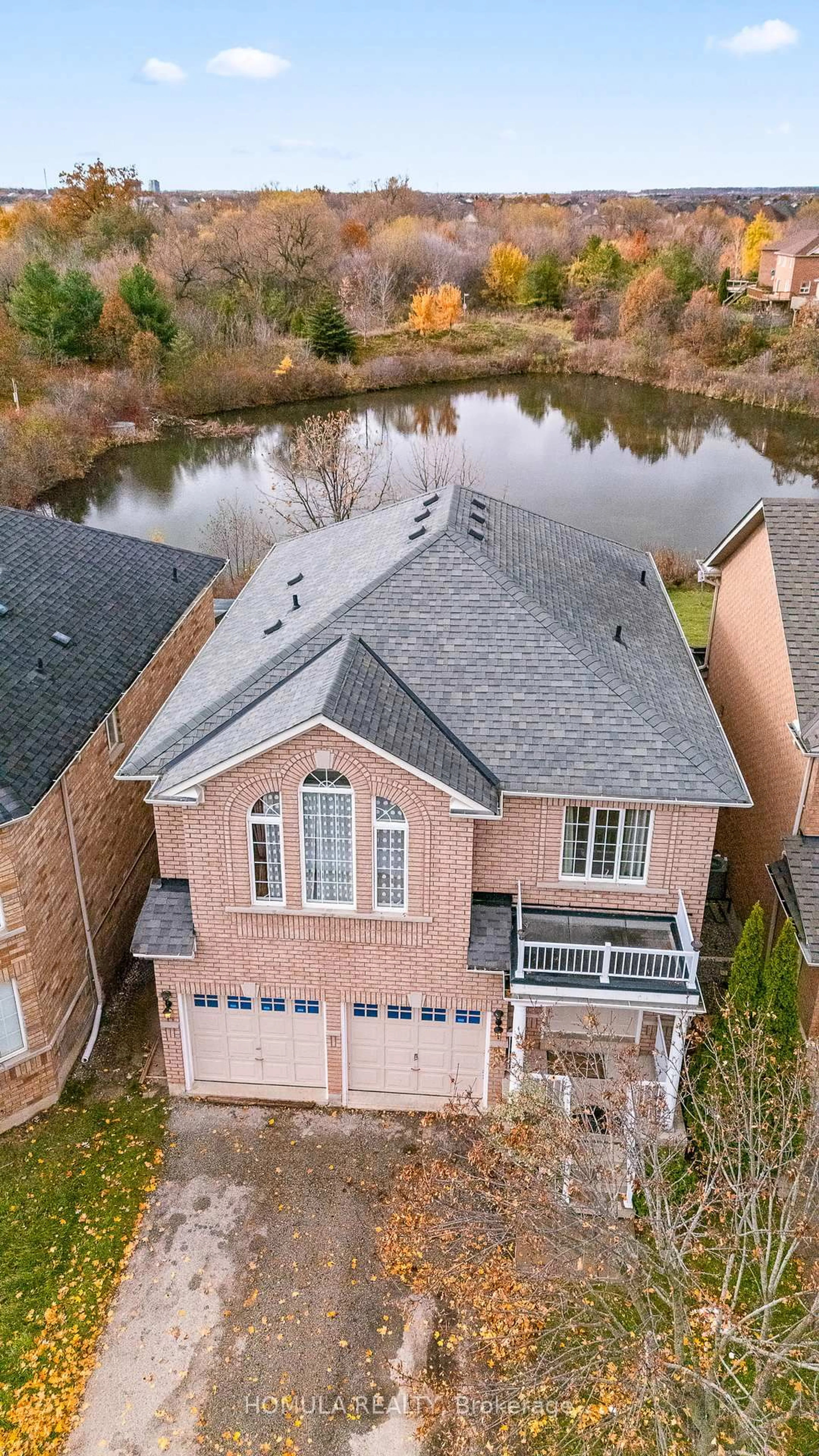 A pic from outside/outdoor area/front of a property/back of a property/a pic from drone, water/lake/river/ocean view for 54 Queen Mary Dr, Brampton Ontario L7A 2K3