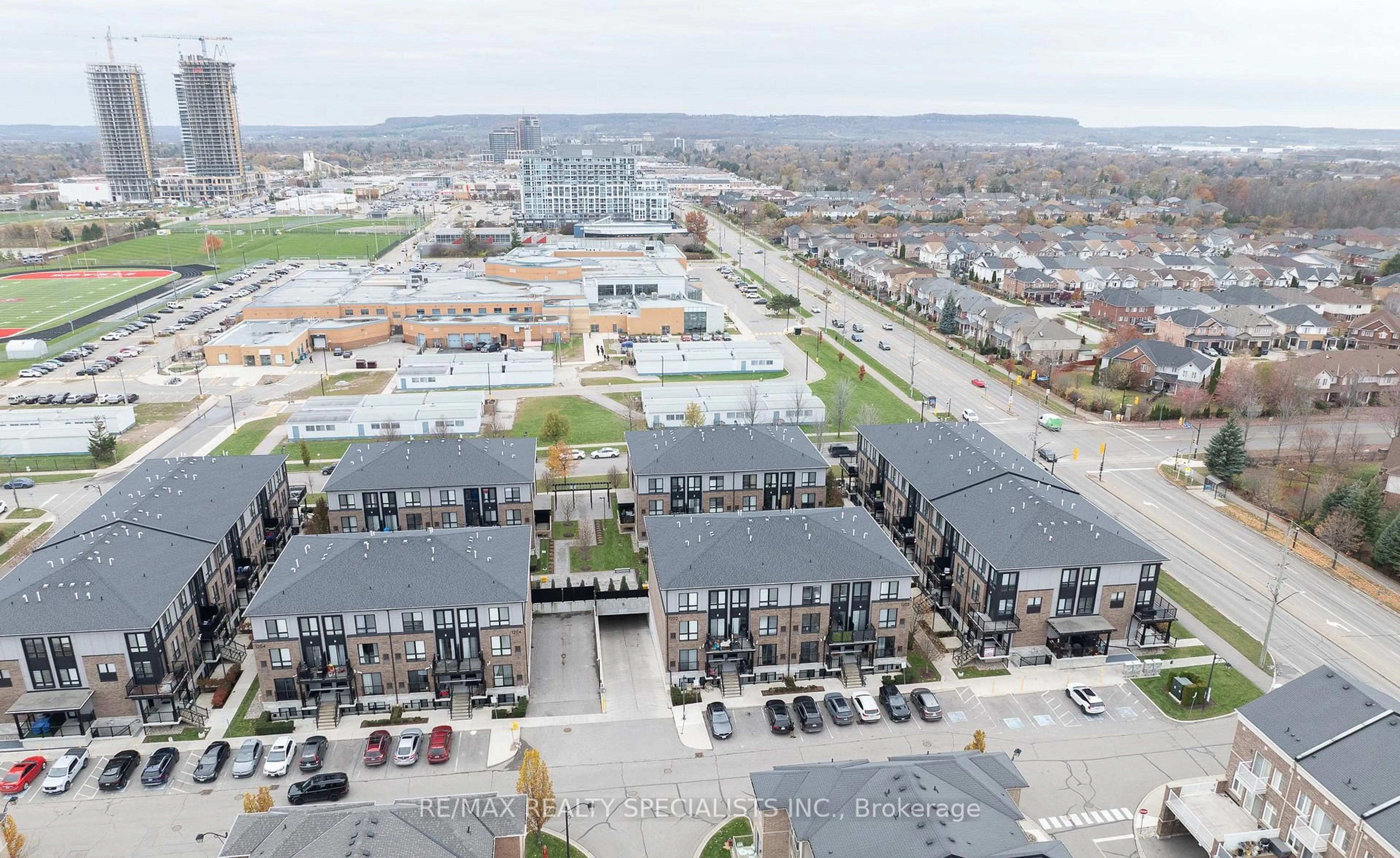 A pic from outside/outdoor area/front of a property/back of a property/a pic from drone, unknown for 1200 Main St #109, Milton Ontario L9T 9K9