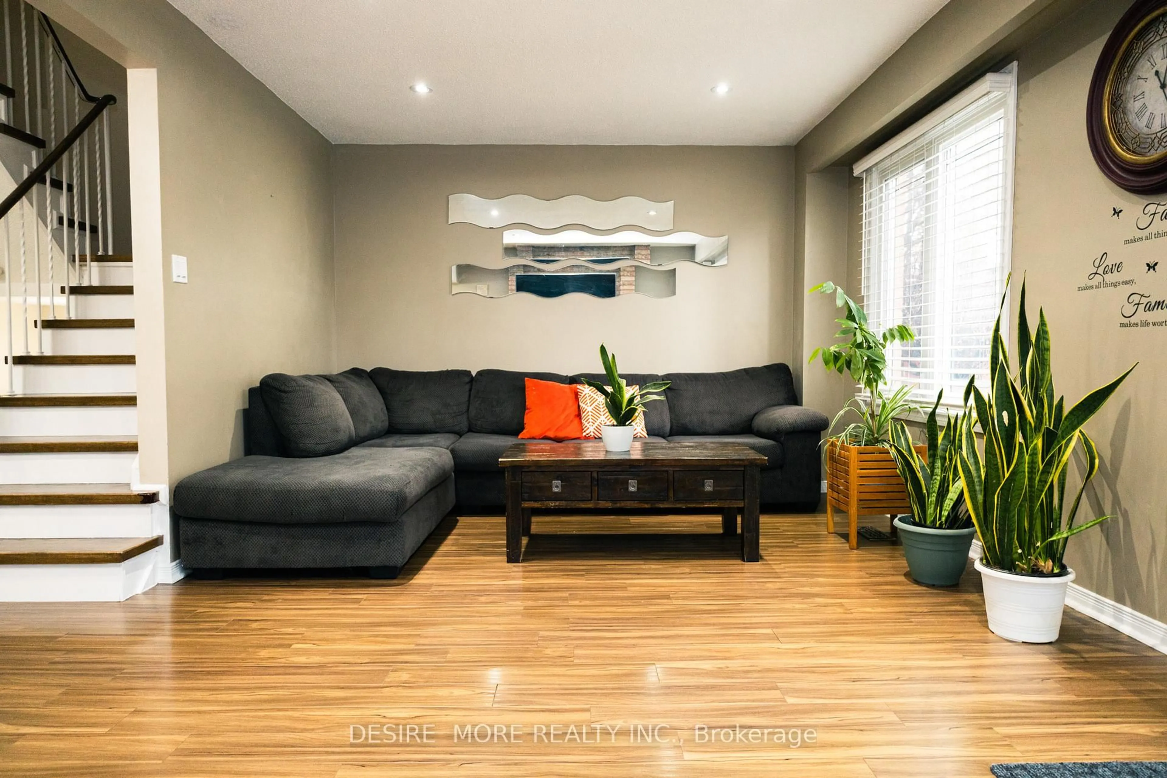 Living room with furniture, wood/laminate floor for 15 Weybridge Tr, Brampton Ontario L6V 3W2