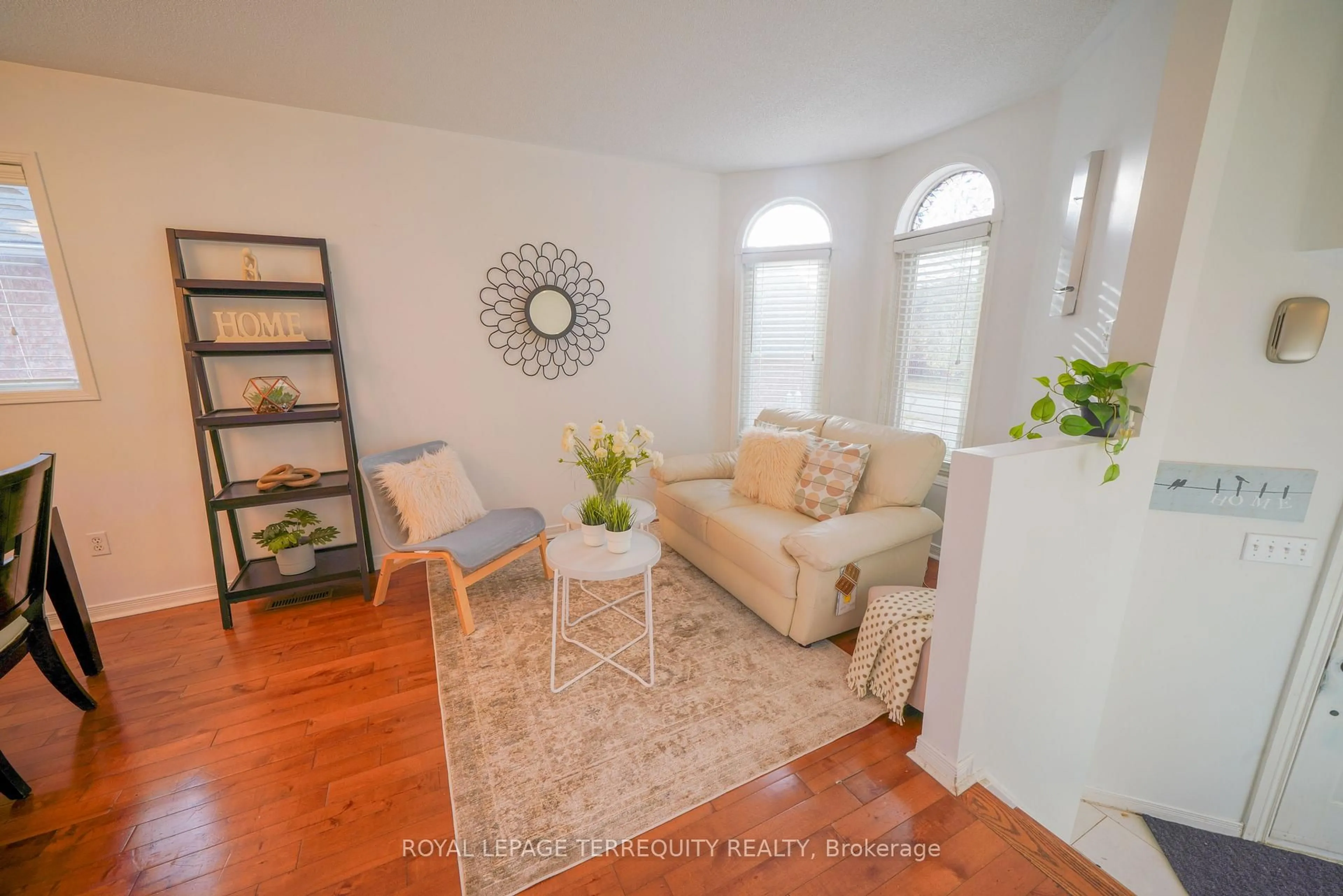 Living room with furniture, wood/laminate floor for 145 Springview Dr, Brampton Ontario L6X 4K2