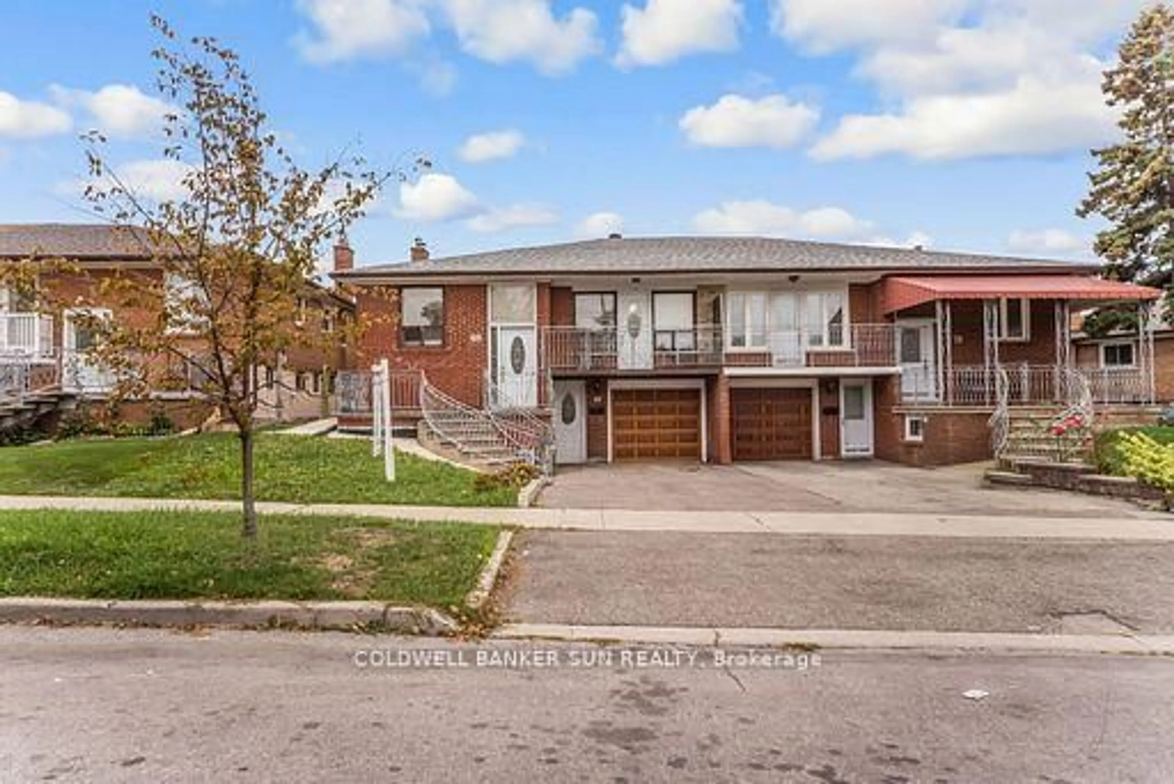 Home with brick exterior material, street for 69 Songwood Dr, Toronto Ontario M9M 1X4