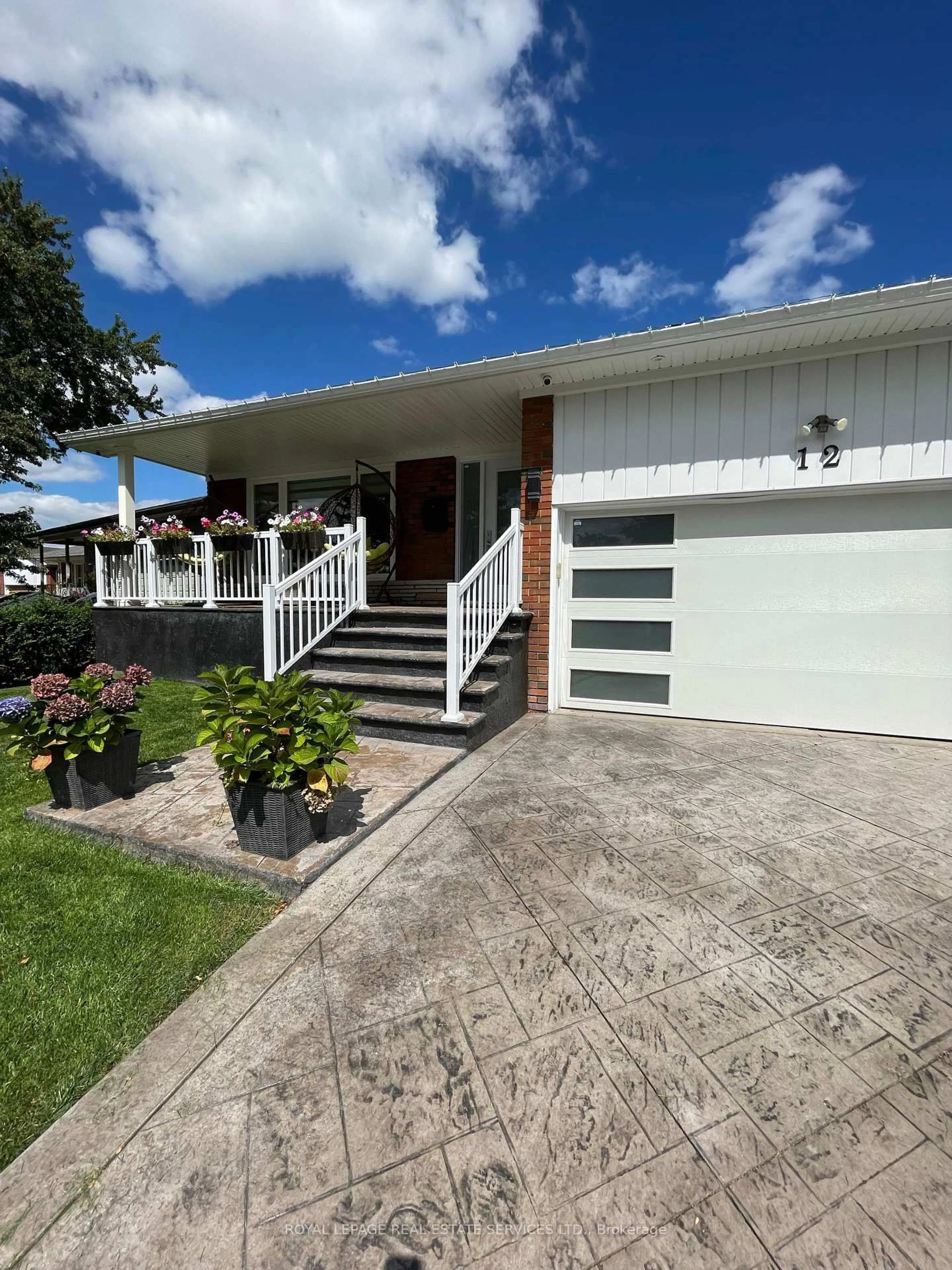 Home with vinyl exterior material, street for 12 Warlingham Crt, Toronto Ontario M9C 3K3