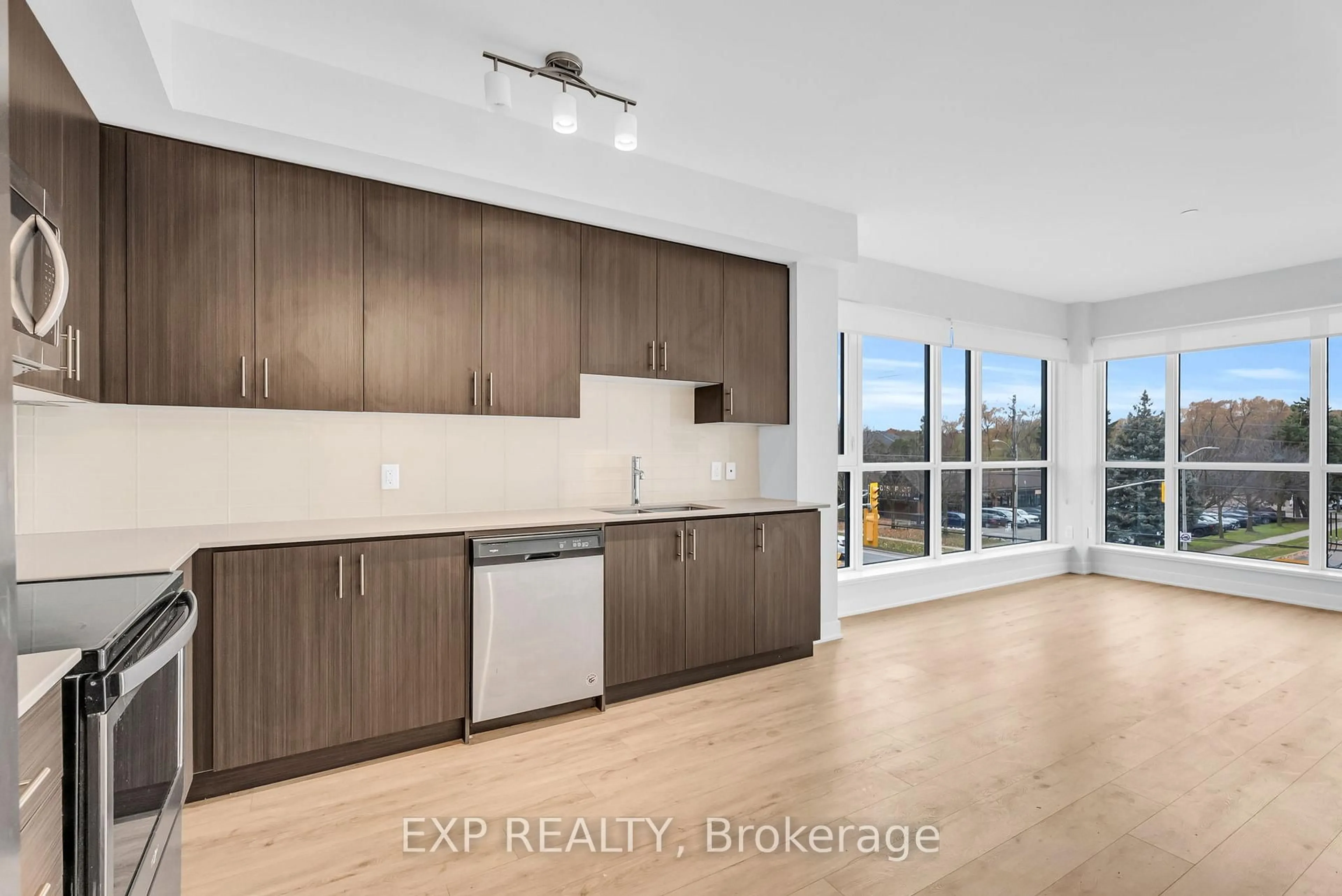 Open concept kitchen, wood/laminate floor for 340 Plains Rd #302, Burlington Ontario L7T 0C2