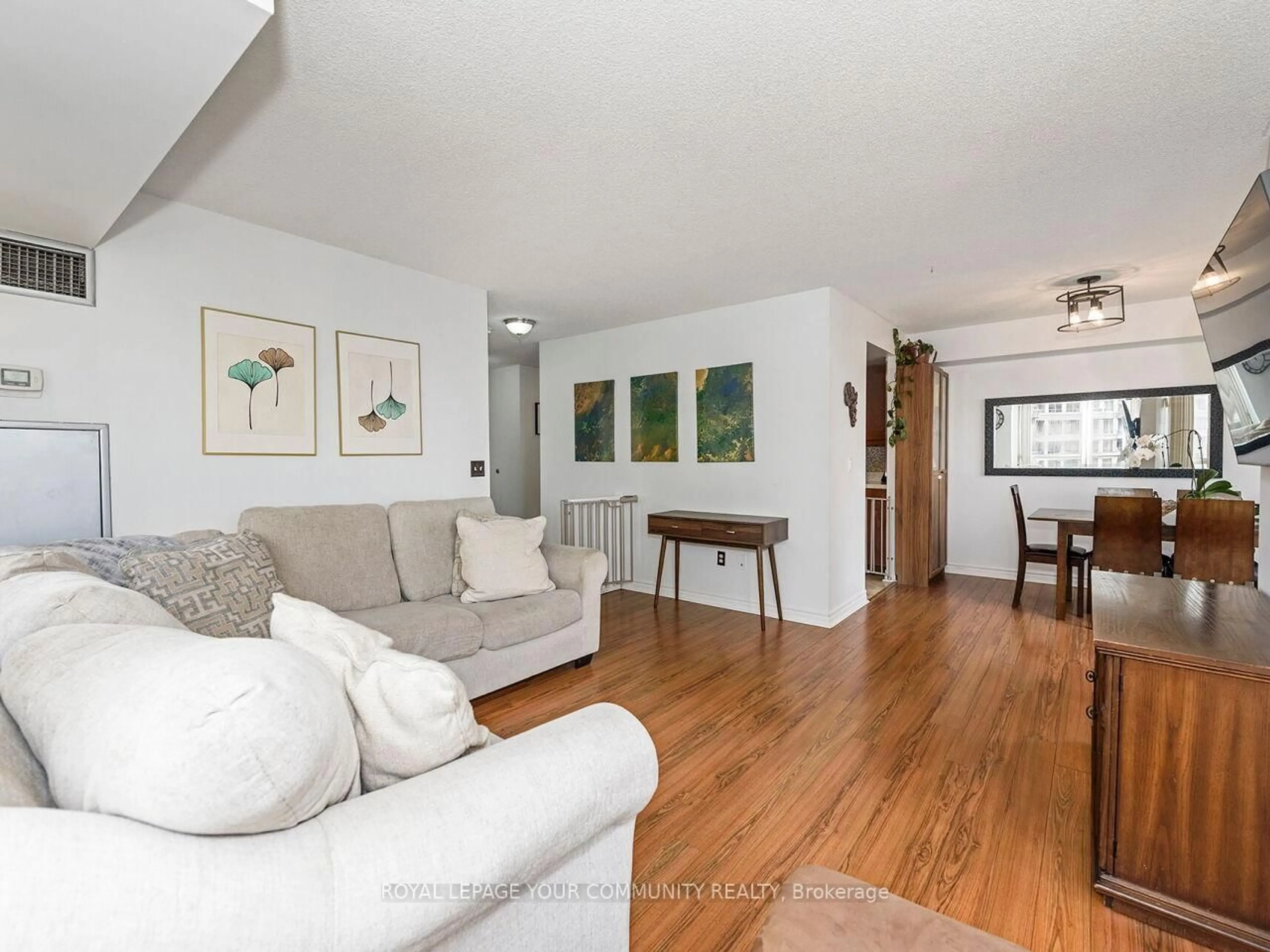 Living room with furniture, wood/laminate floor for 325 Webb Dr #1109, Mississauga Ontario L5B 3Z9