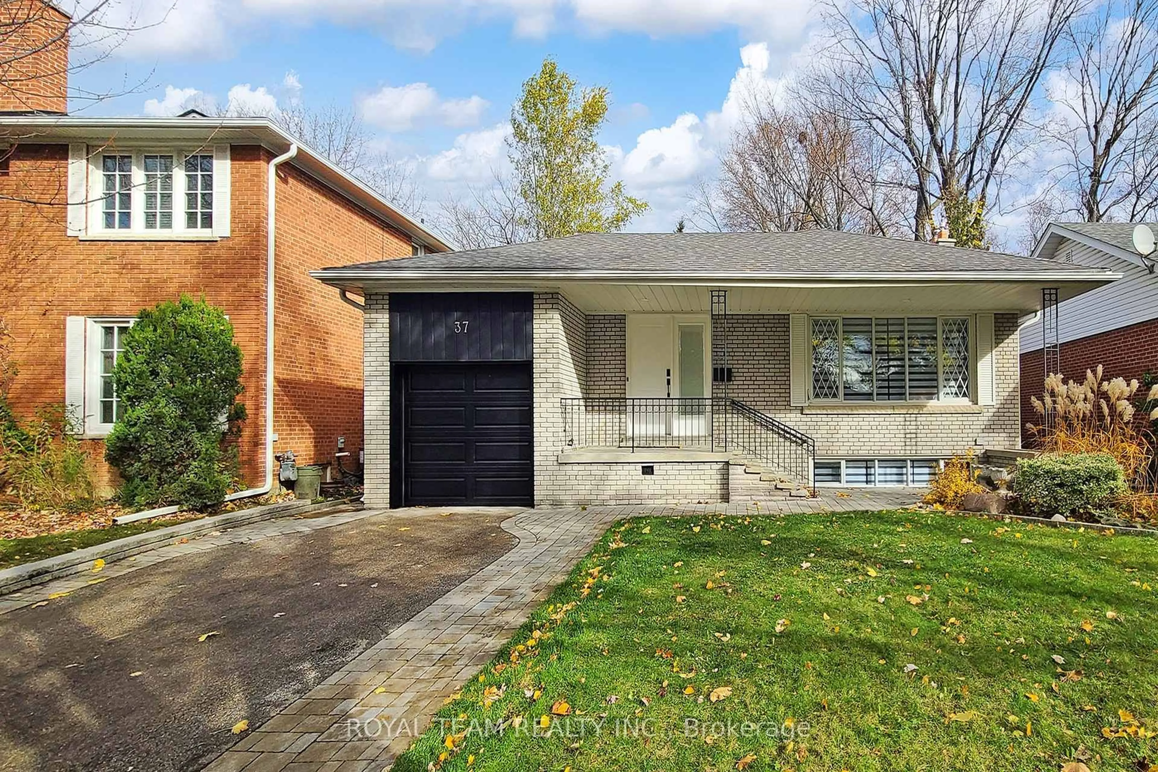 Home with brick exterior material, street for 37 Markland Dr, Toronto Ontario M9C 1M9