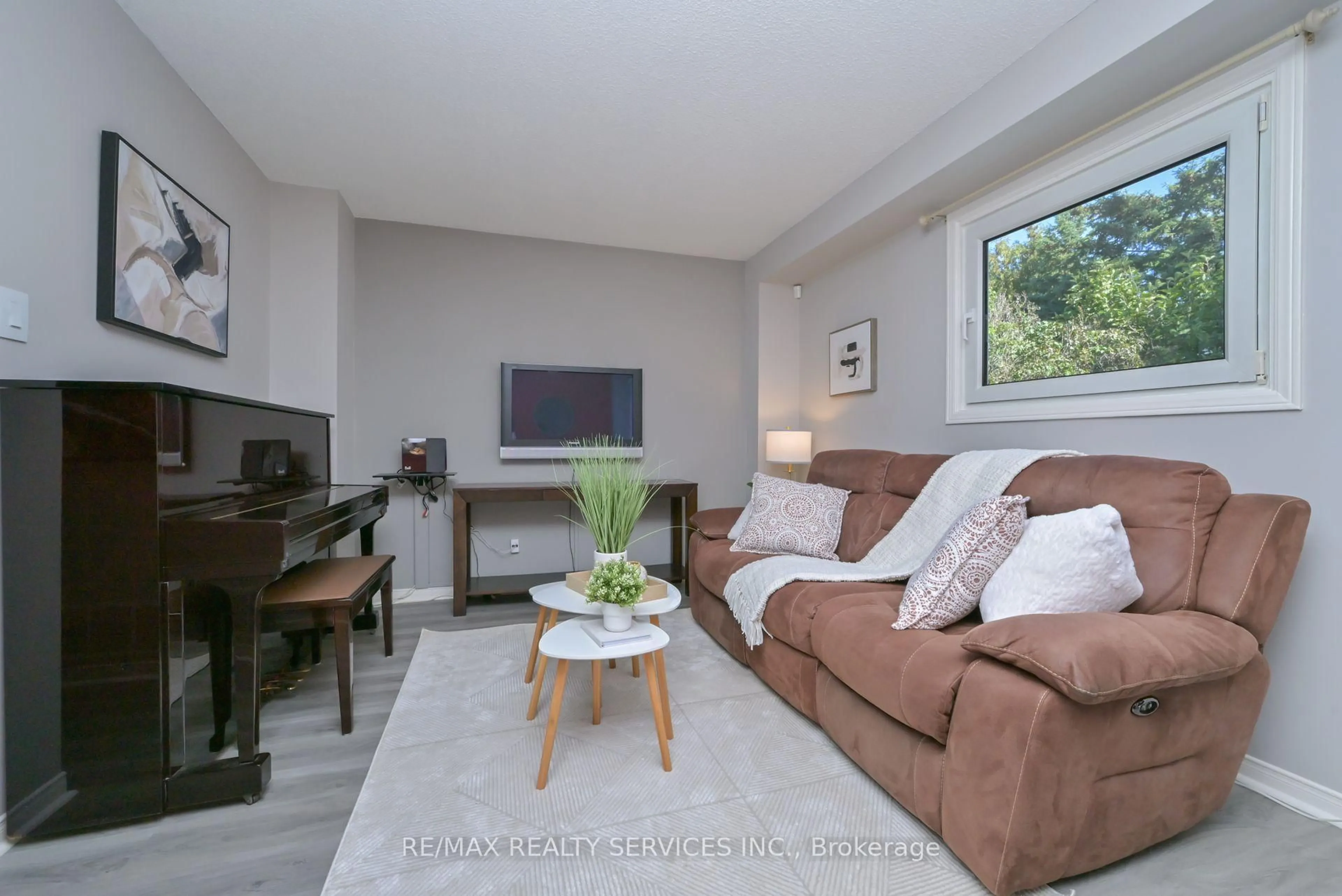 Living room with furniture, wood/laminate floor for 8 Oleander Cres, Brampton Ontario L6Z 2C2