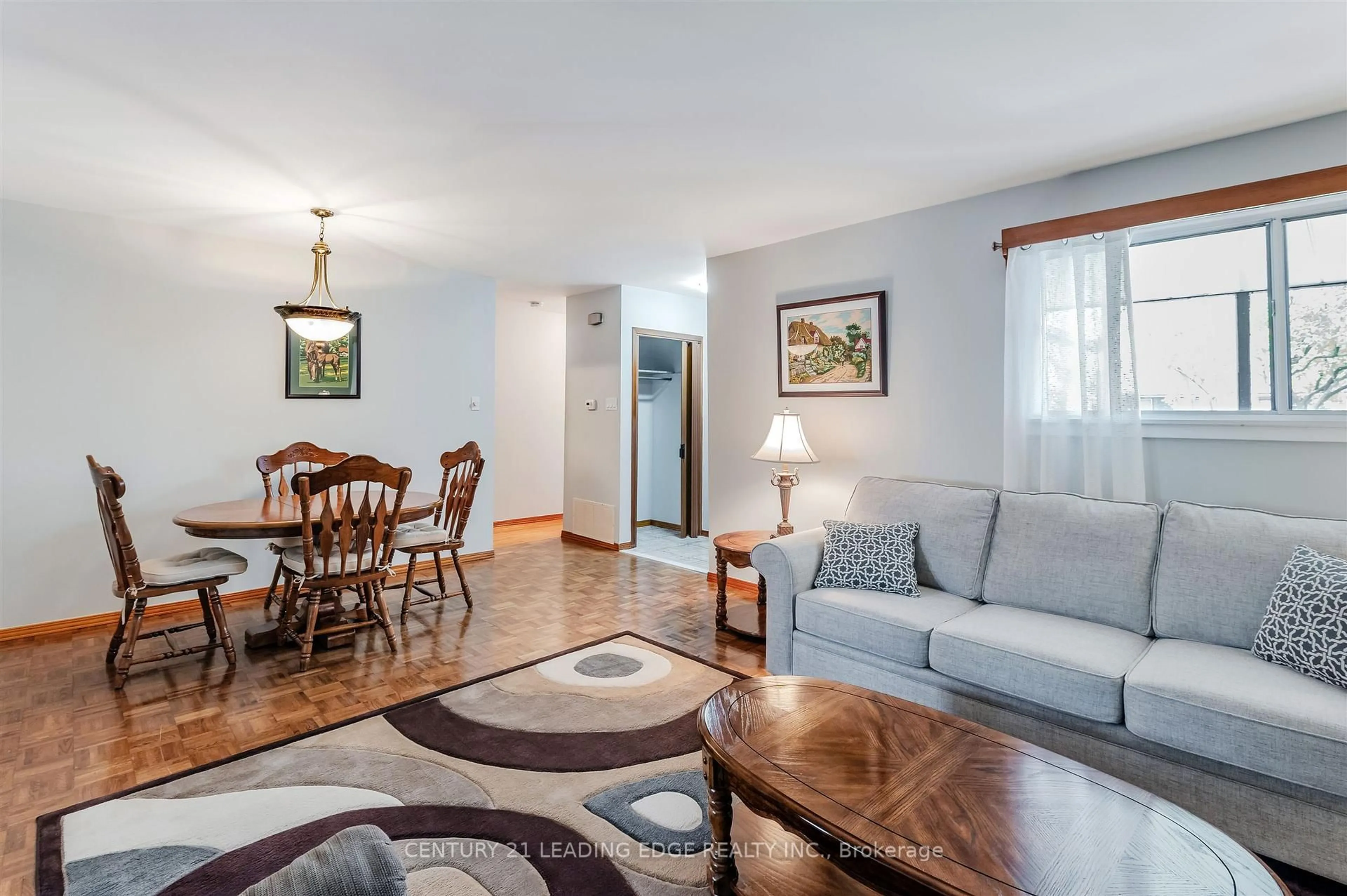 Living room with furniture, wood/laminate floor for 41 Stanley Crt, Brampton Ontario L6Y 2B1