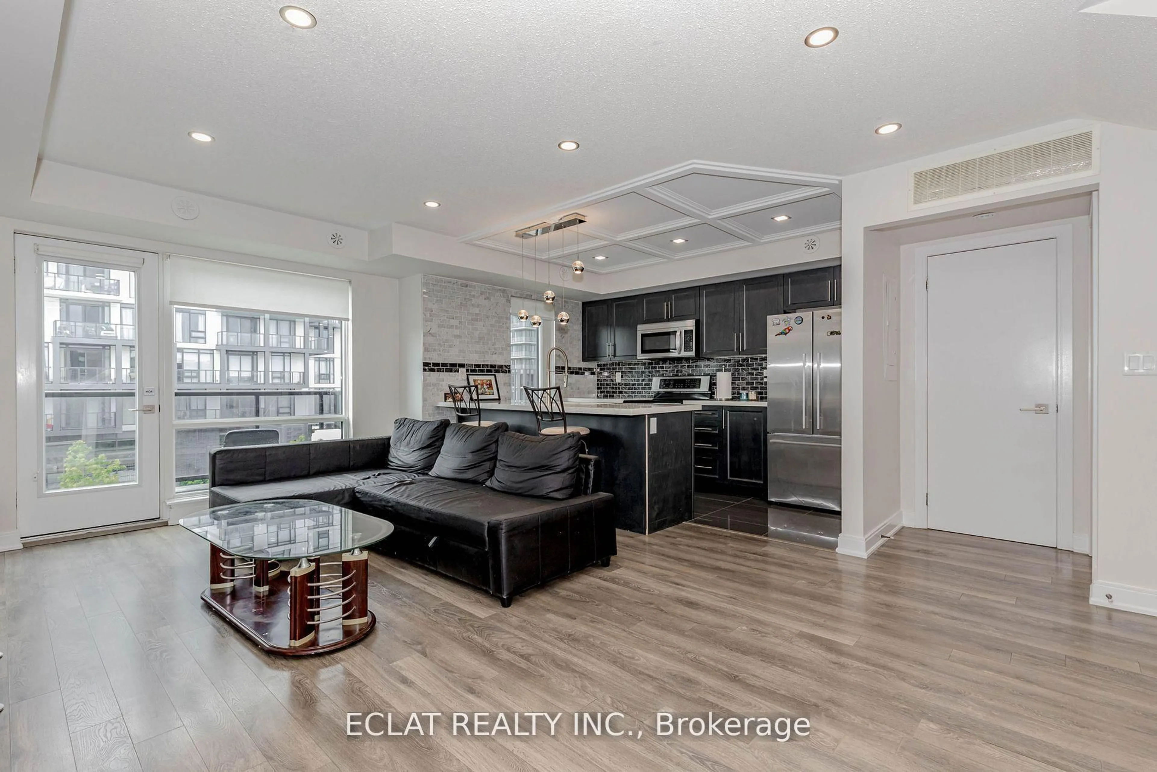 Open concept kitchen, unknown for 100 Dufay Rd #100, Brampton Ontario L7A 4S3