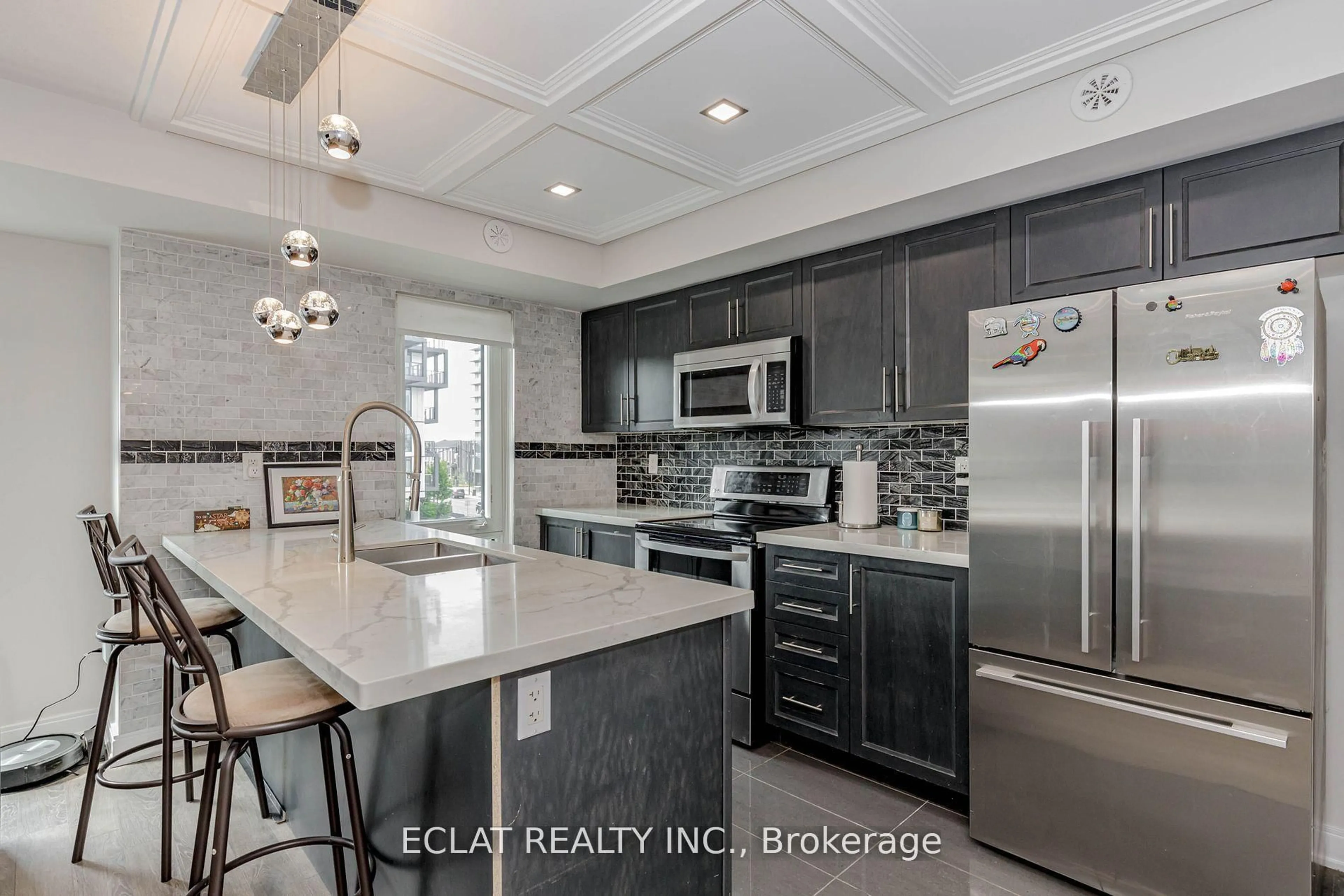 Open concept kitchen, ceramic/tile floor for 100 Dufay Rd #100, Brampton Ontario L7A 4S3