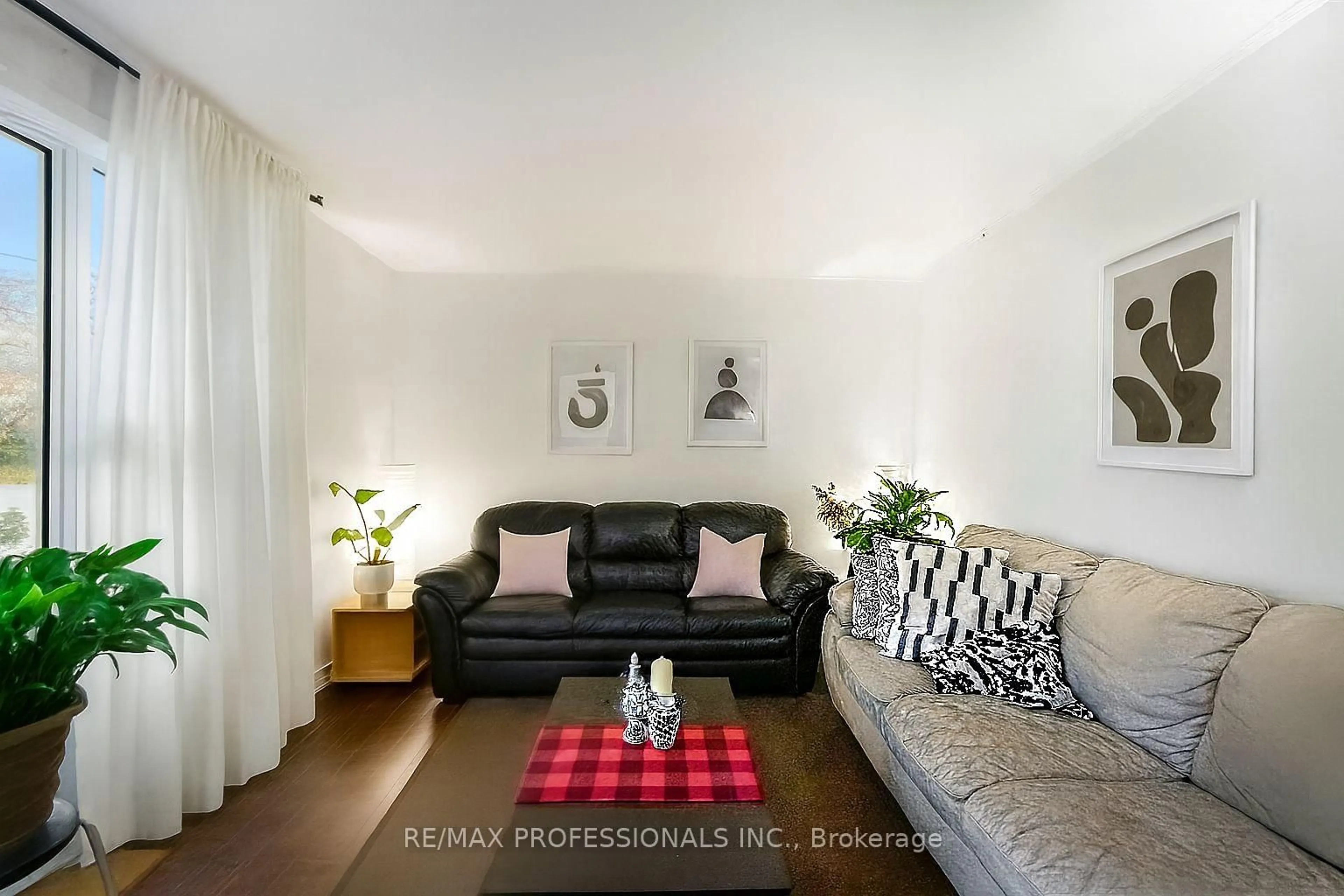 Living room with furniture, wood/laminate floor for 135 Allenby Ave, Toronto Ontario M9W 1T2