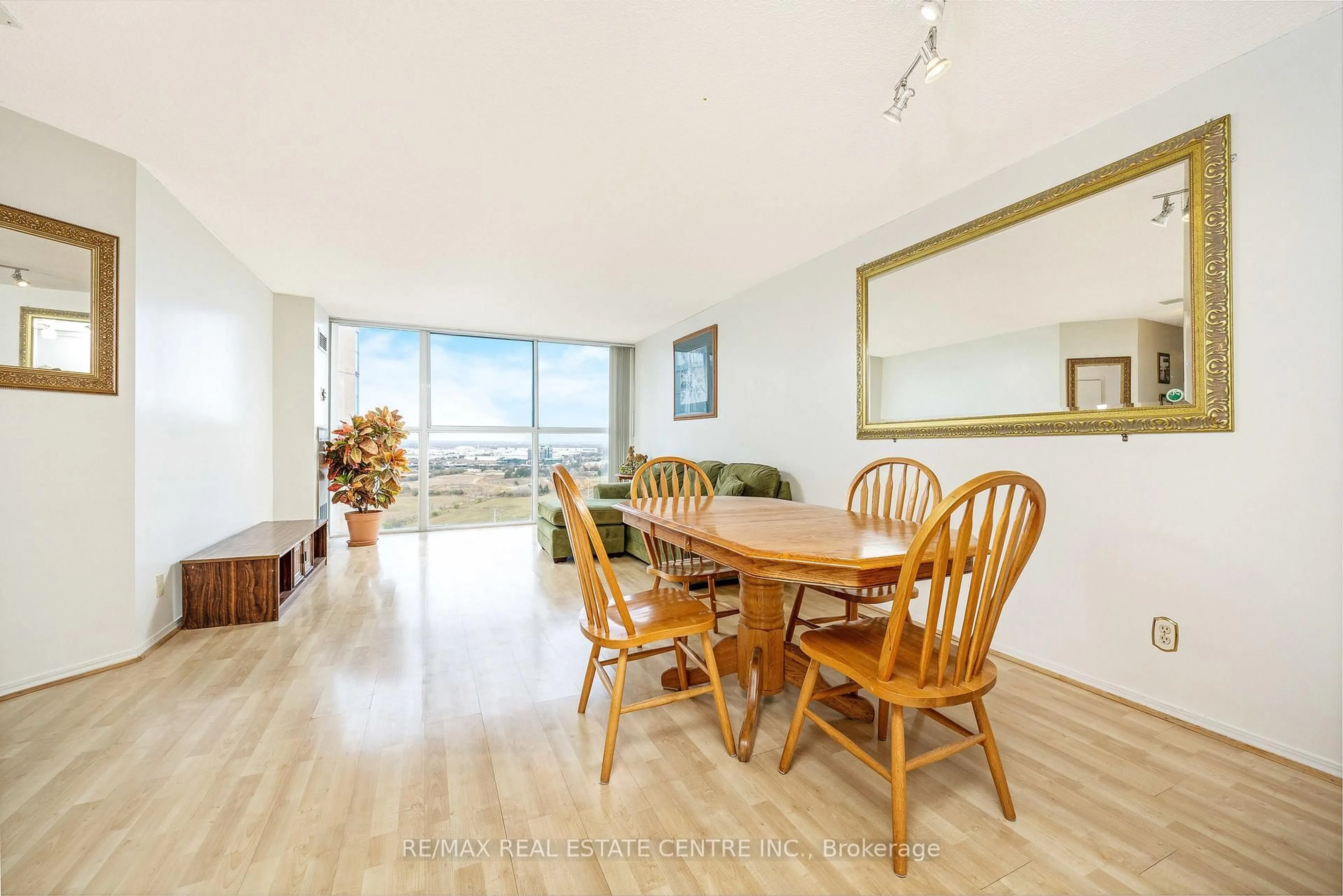 Dining room, wood/laminate floor for 35 Trailwood Dr #2216, Mississauga Ontario L4Z 3L6